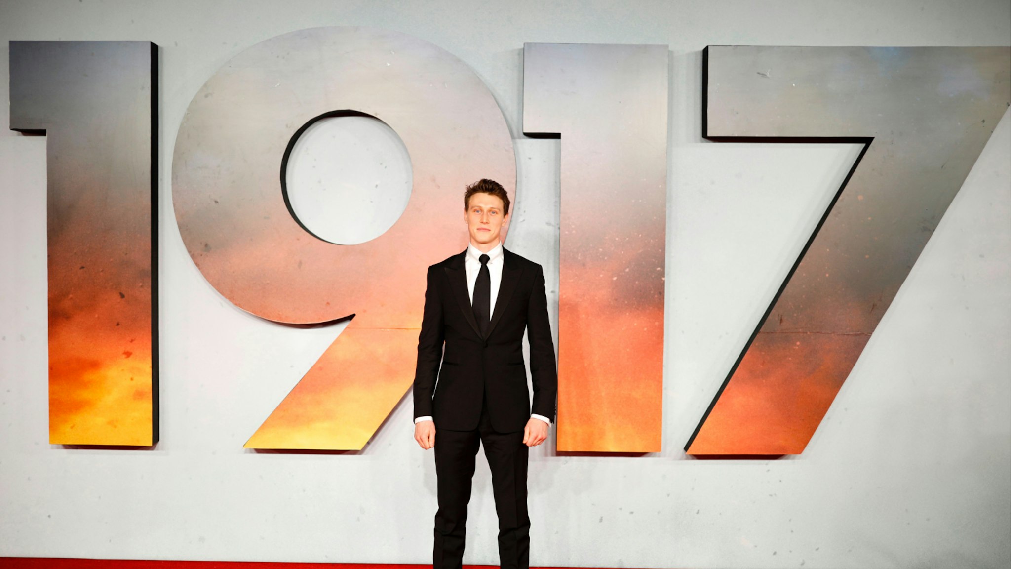 British actor George MacKay poses on the red carpet as he arrives to attend the World premiere and Royal Film Performance of the film "1917" in London on December 4, 2019, in support of the film and TV charity.