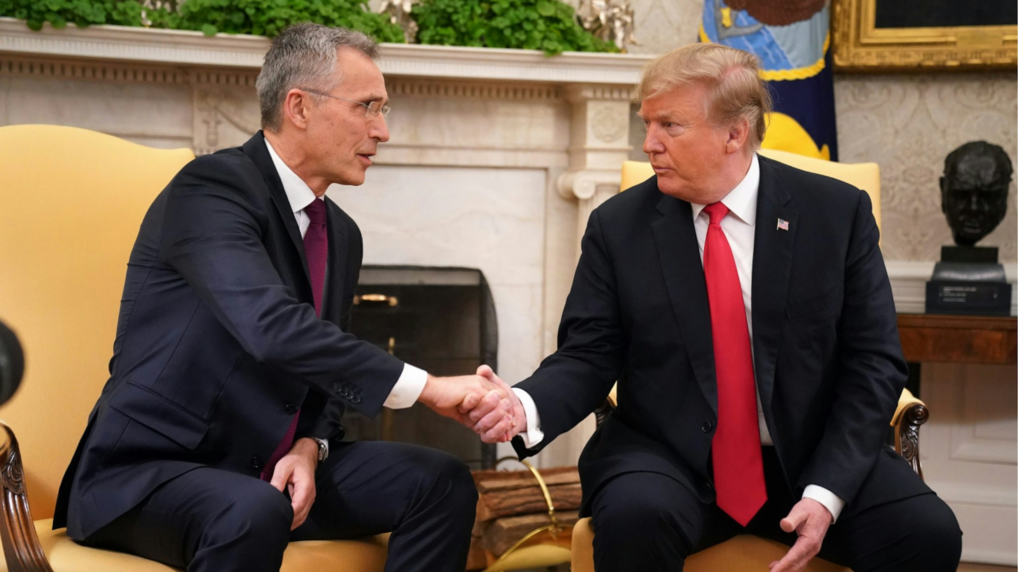 NATO Secretary General Jens Stoltenberg (L) and U.S. President Donald Trump shake hands in the Oval Office at the White House April 02, 2019 in Washington, DC.