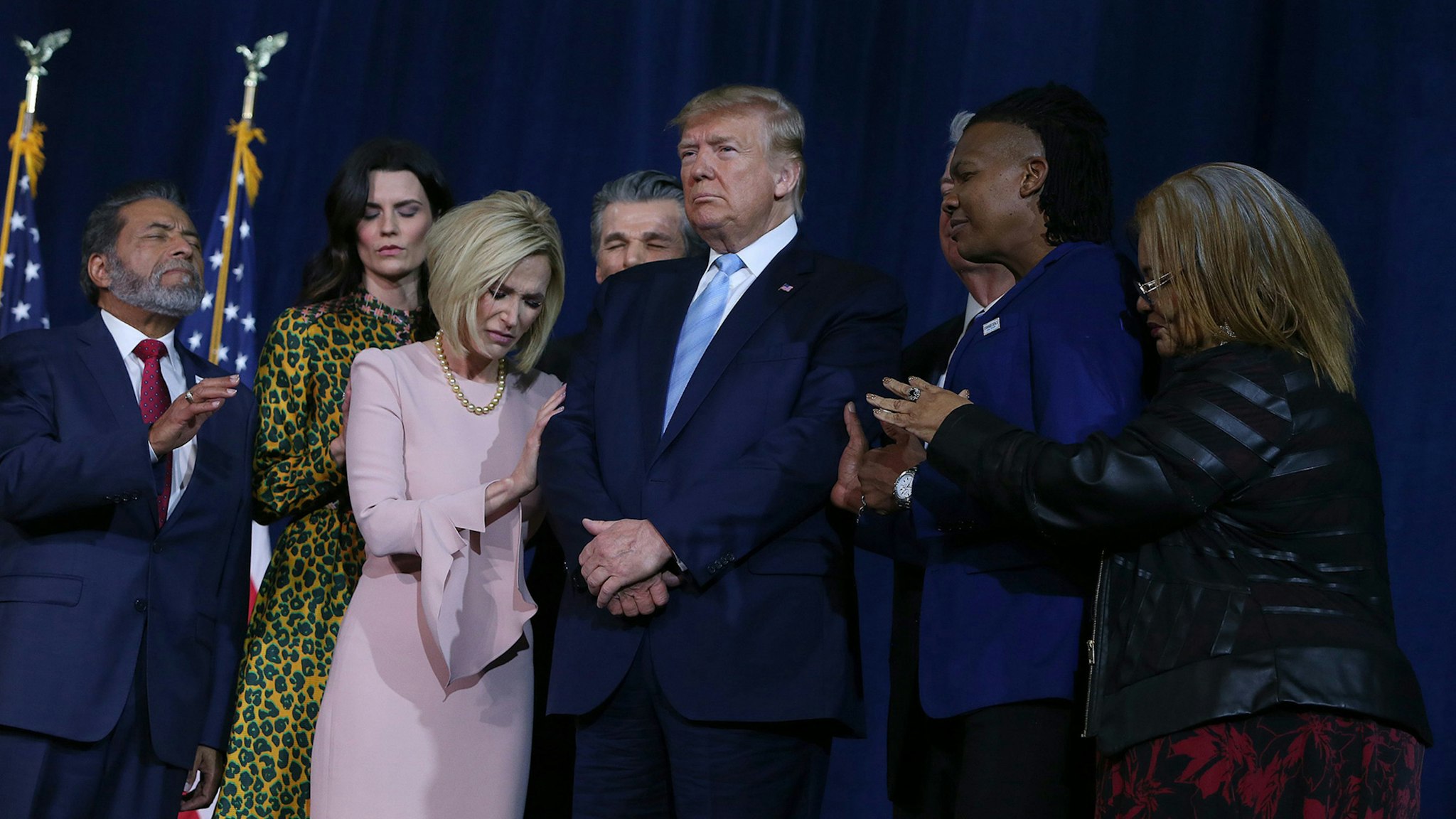 A group of religious leaders pray for President Donald Trump during an "Evangelicals for Trump" campaign rally at El Rey Jesus Evangelical church in Kendall, Fla., on Friday, Jan. 3, 2020.