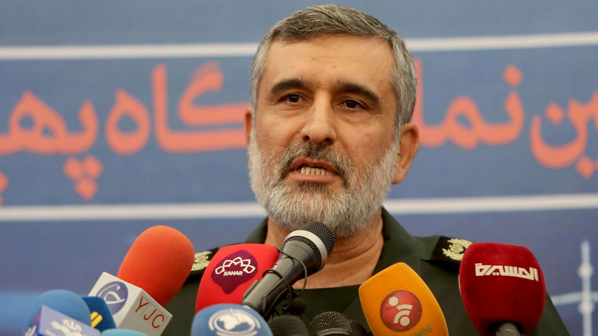 General Amir Ali Hajizadeh, the head of the Revolutionary Guard's aerospace division, speaks at Tehran's Islamic Revolution and Holy Defence museum, during the unveiling of an exhibition of what Iran says are US and other drones captured in its territory, in the capital Tehran on September 21, 2019. - Iran's Revolutionary Guards commander today warned any country that attacks the Islamic republic will see its territory become the "main battlefield" as he opened an exhibition of captured drones