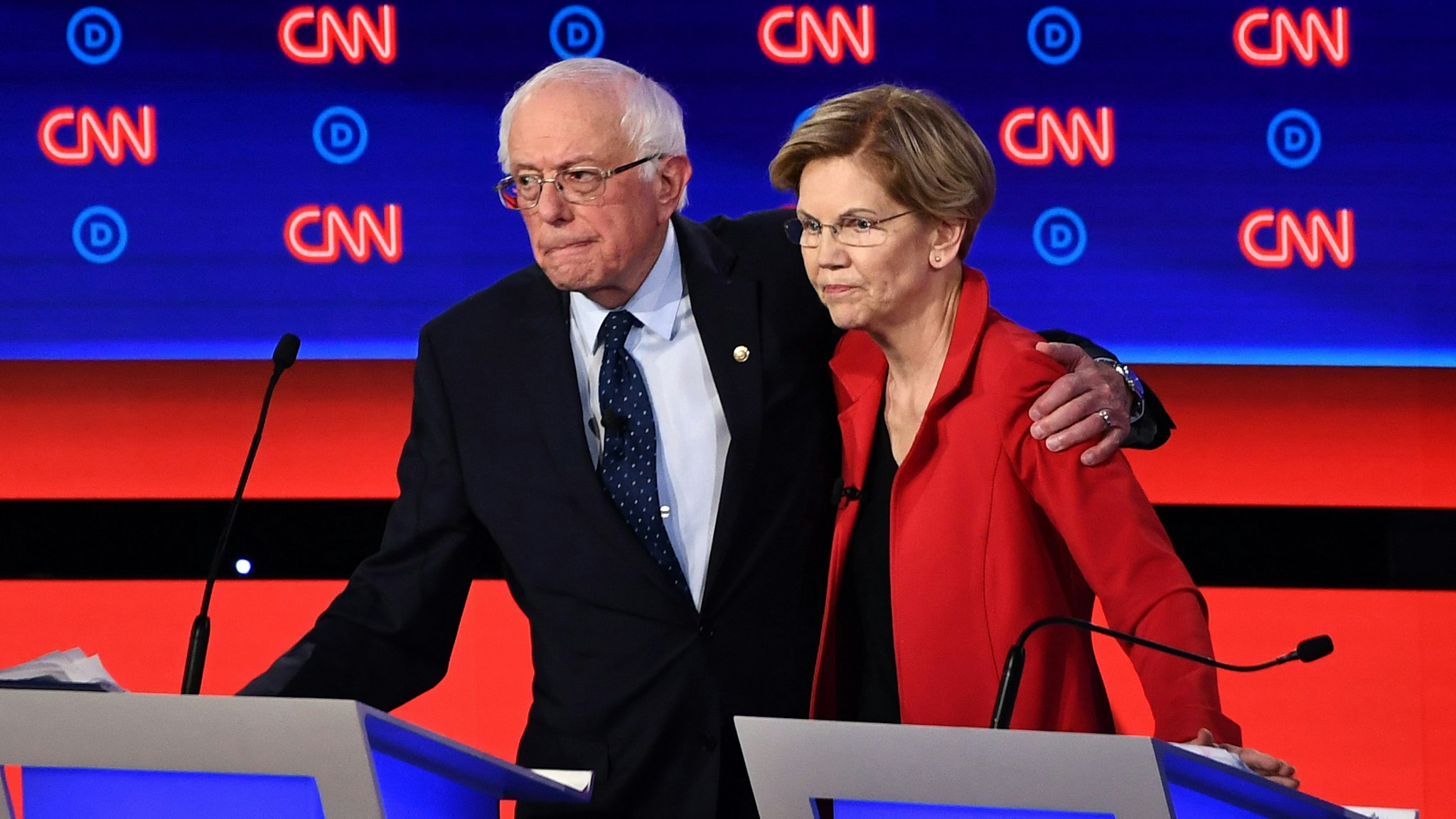 Democratic presidential hopefuls US senator from Vermont Bernie Sanders (L) and US Senator from Massachusetts Elizabeth Warren hug after participating in the first round of the second Democratic primary debate of the 2020 presidential campaign season hosted by CNN at the Fox Theatre in Detroit, Michigan on July 30, 2019.