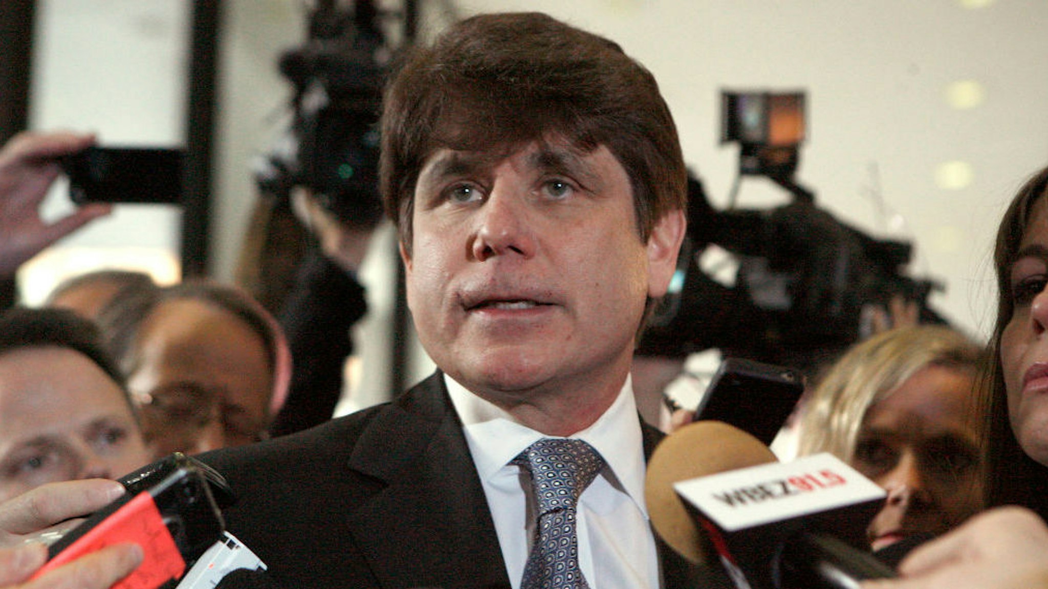 Former Illinois Governor Rod Blagojevich pauses while speaking to the media at the Dirksen Federal Building December 7, 2011 in Chicago, Illinois. Blagojevich was sentenced to 14 years in prison after he was found guilty of 17 public corruption charges. (Photo by Frank Polich/Getty Images)