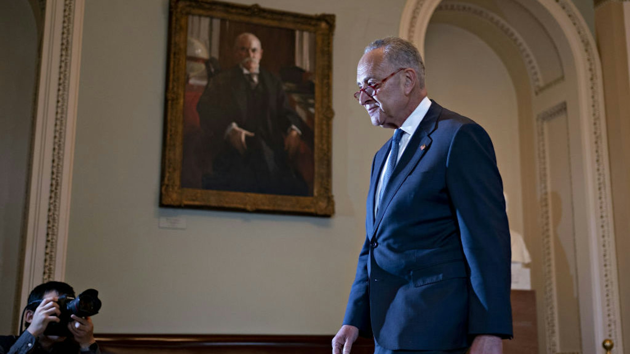 Senate Minority Leader Chuck Schumer, a Democrat from New York, walks to his office after speaking on the Senate floor at the U.S. Capitol in Washington, D.C., U.S., on Friday, Jan. 3, 2020. House Speaker Nancy Pelosi and Senate Majority Leader Mitch McConnell are locked in a stare-down over the terms of President Donald Trump's impeachment trial, which carries political risks for both sides if it continues deeper into January. Photographer: Andrew Harrer/Bloomberg