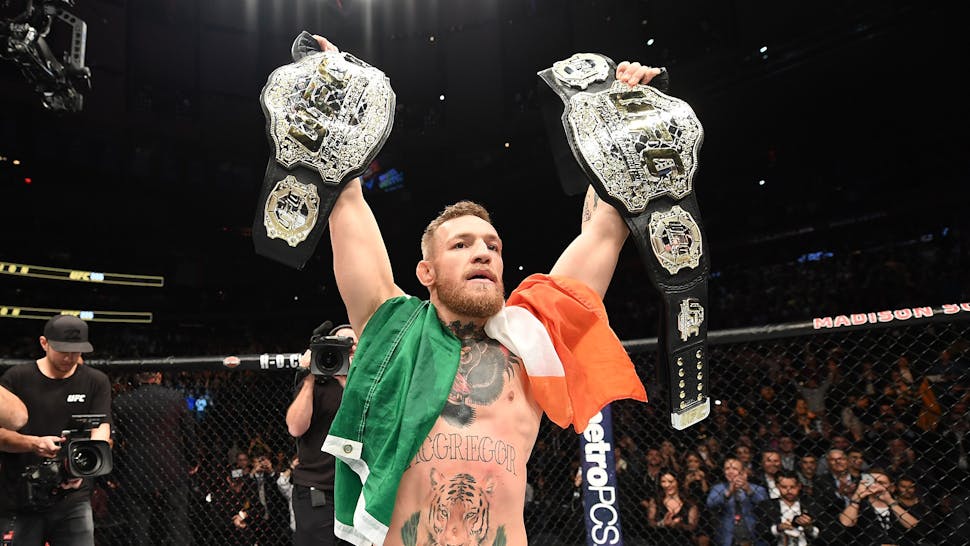 UFC 205: Alvarez v McGregor NEW YORK, NY - NOVEMBER 12: UFC lightweight and featherweight champion Conor McGregor of Ireland celebrates after defeating Eddie Alvarez in their UFC lightweight championship fight during the UFC 205 event at Madison Square Garden on November 12, 2016 in New York City.