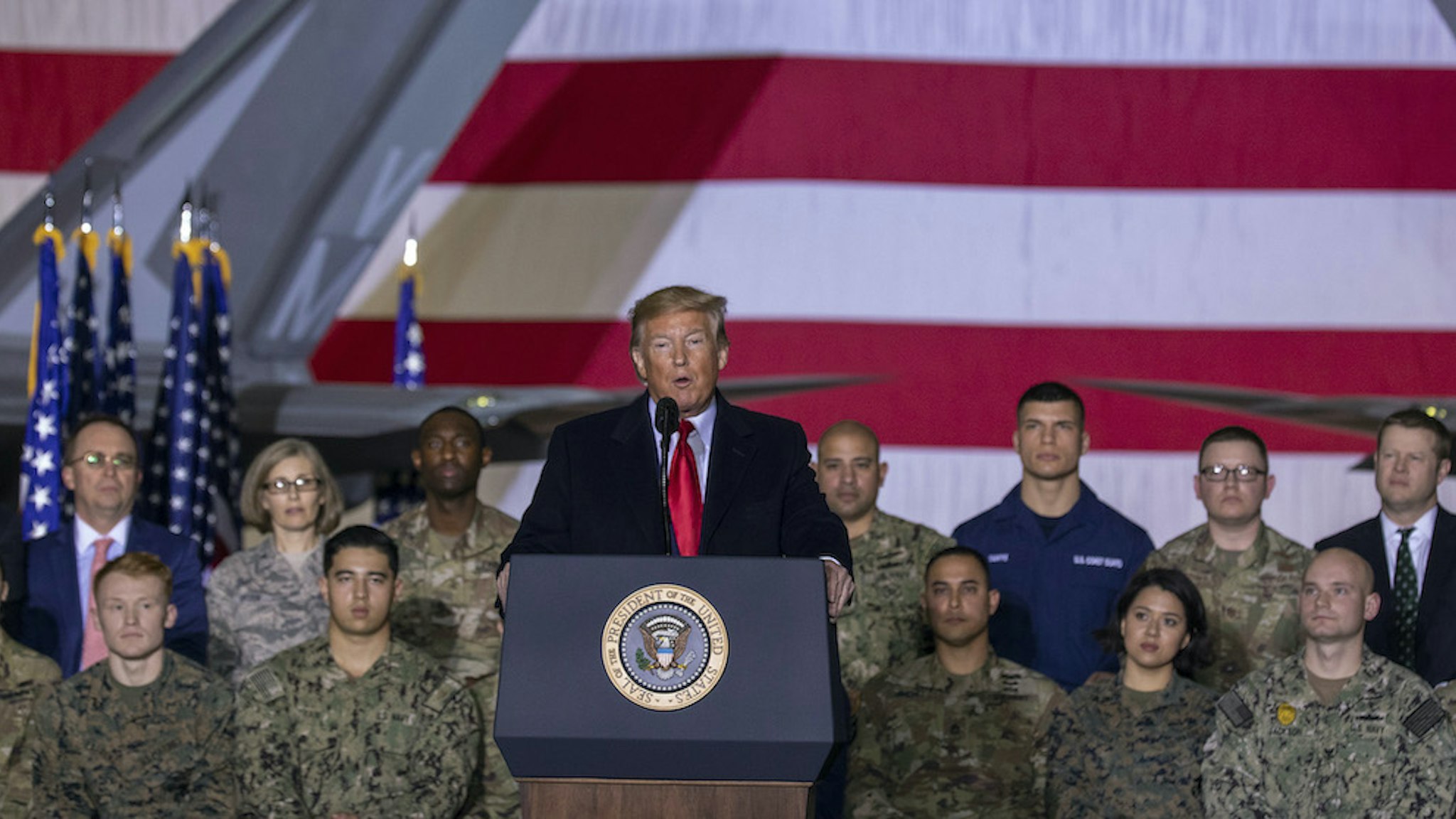 US President Donald Trump speaks at the signing ceremony for S.1709, The National Defense Authorization Act for Fiscal Year 2020 on December 20, 2019 in Joint Base Andrews, Maryland. President Trump is headed to Florida for the Holidays after a historic impeachment vote on the house floor this week. (Photo by Tasos Katopodis/Getty Images)