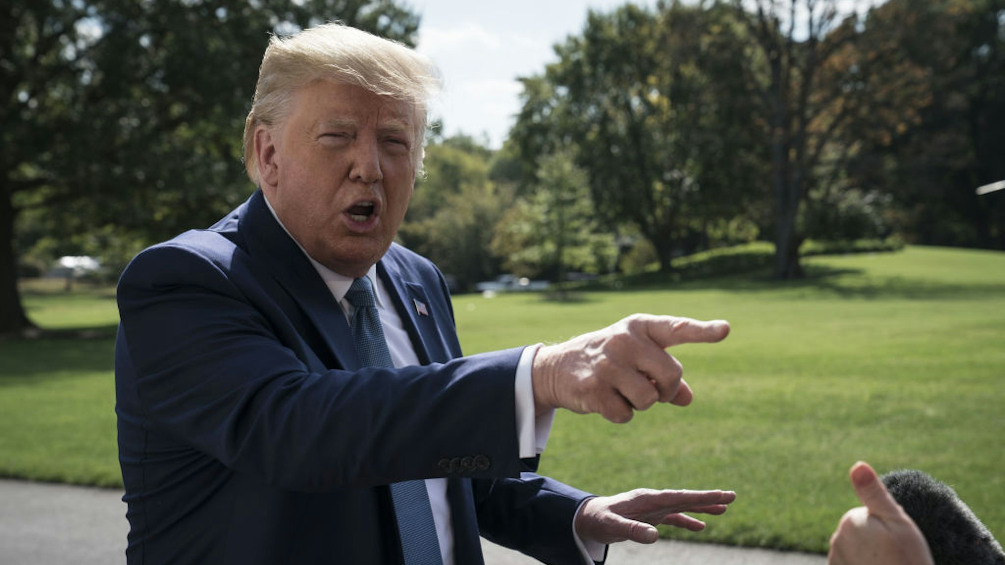 President Donald Trump speaks to members of the media outside of the White House in Washington, D.C., U.S., on Friday, Oct. 4, 2019.