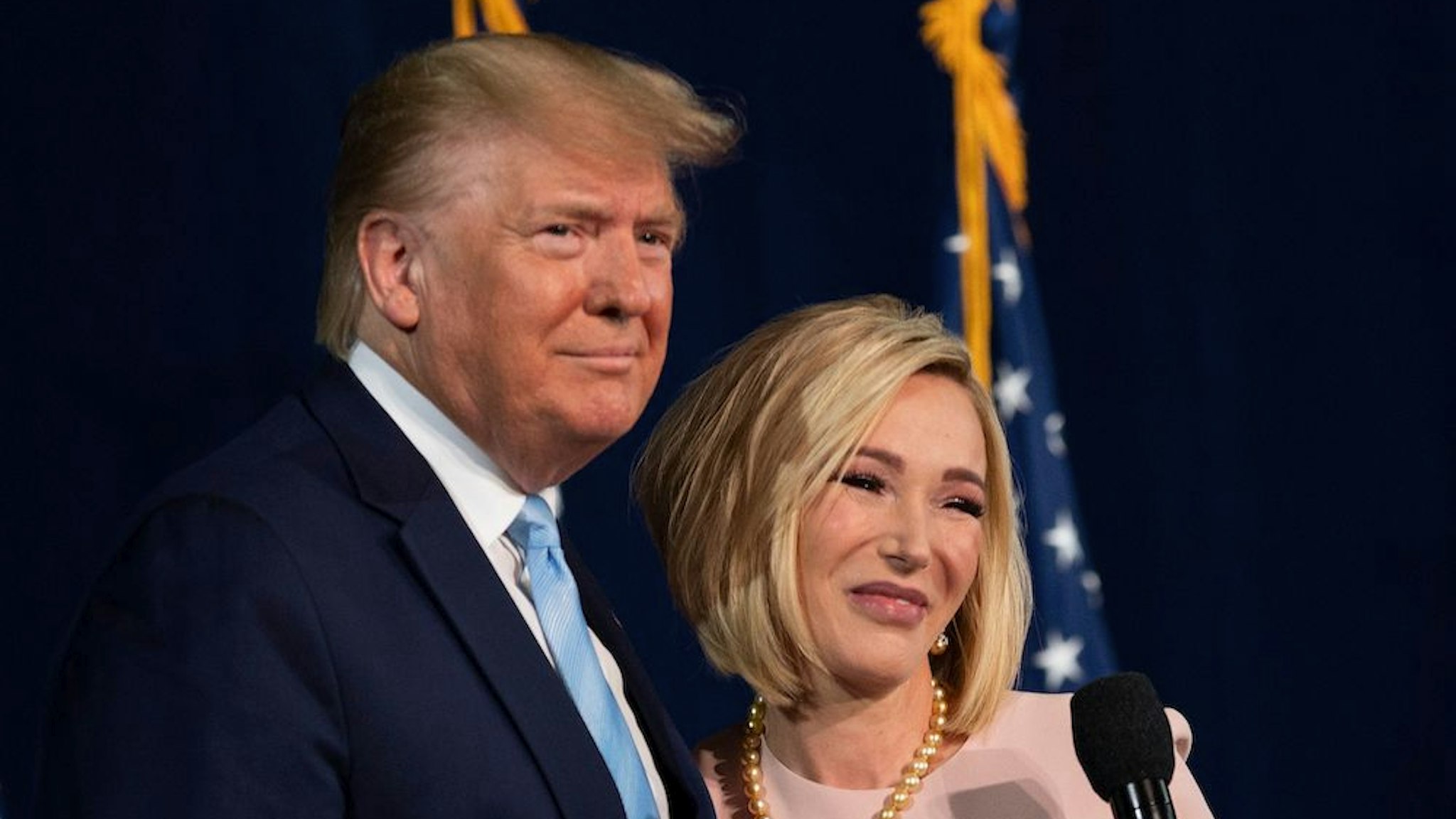 US President Donald Trump stands with Pastor Paula White during a 'Evangelicals for Trump' campaign event held at the King Jesus International Ministry on January 03, 2020 in Miami, Florida. (Photo by JIM WATSON / AFP) (Photo by JIM WATSON/AFP via Getty Images)