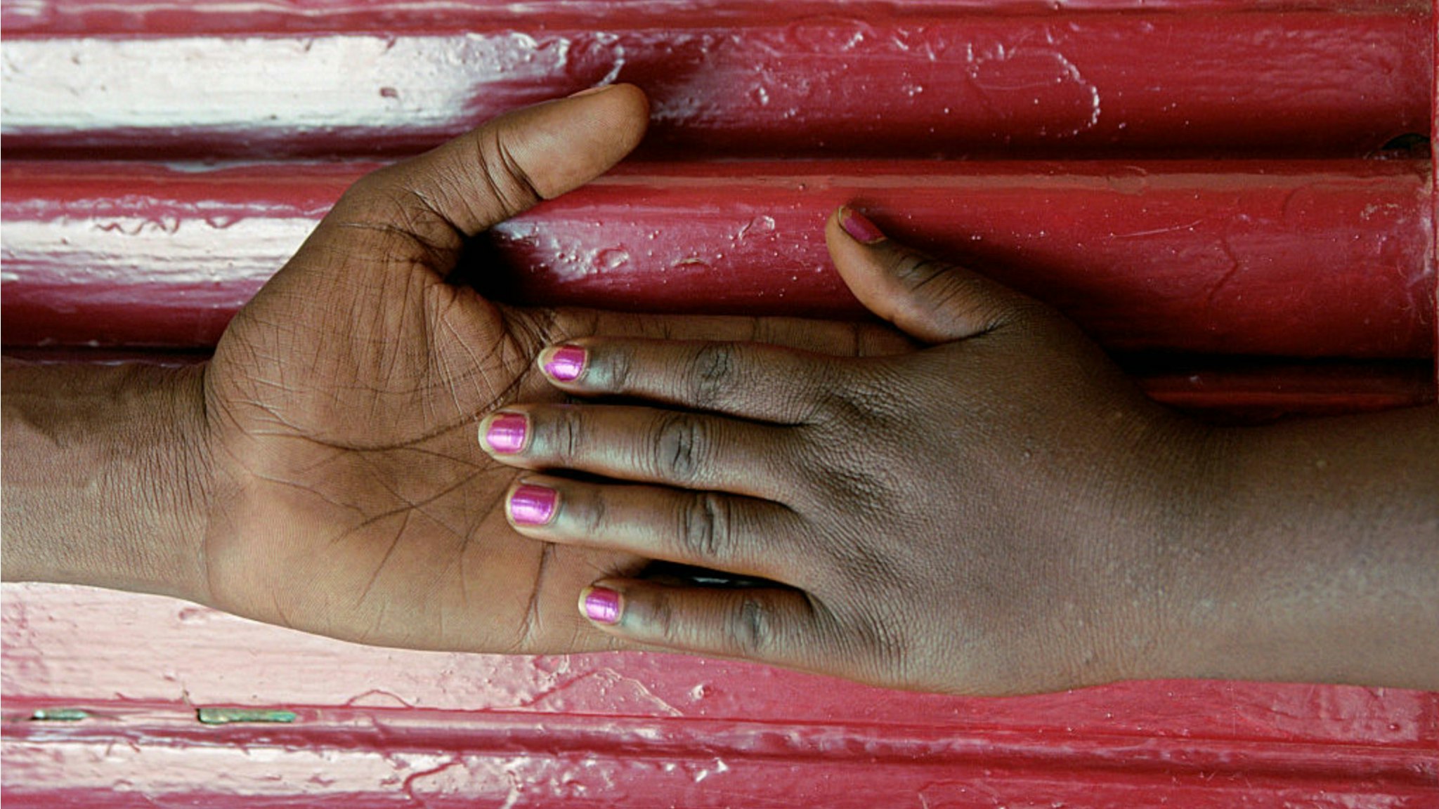 The hands of a couple that met, fell and fell in love at the Oasis project, a community-based program which provides antiretroviral therapy, employment and financial support for people living with HIV and AIDS.