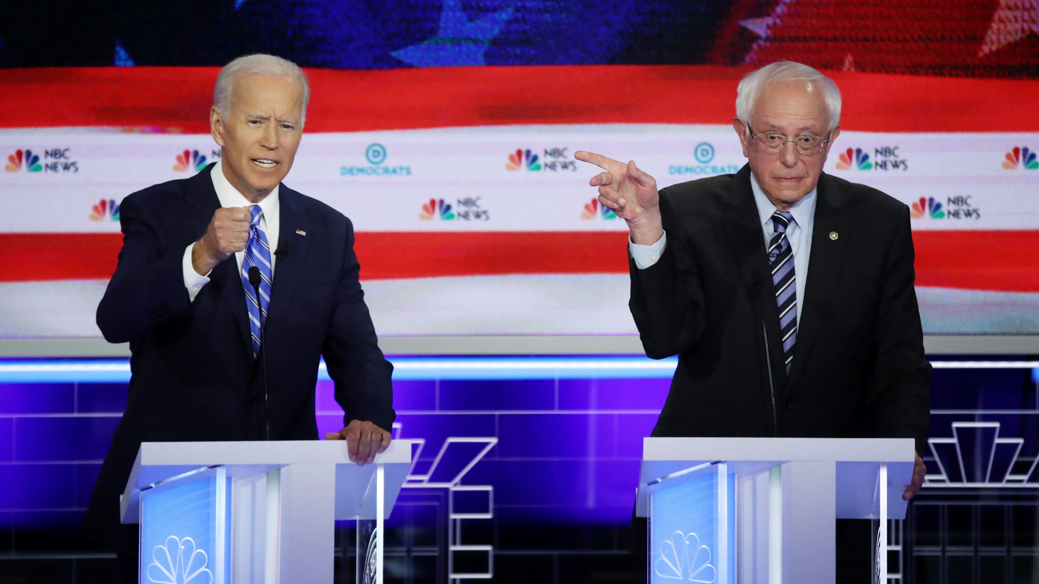 Democratic presidential candidates former Vice President Joe Biden and Sen. Bernie Sanders (I-VT) speak during the second night of the first Democratic presidential debate on June 27, 2019 in Miami, Florida.