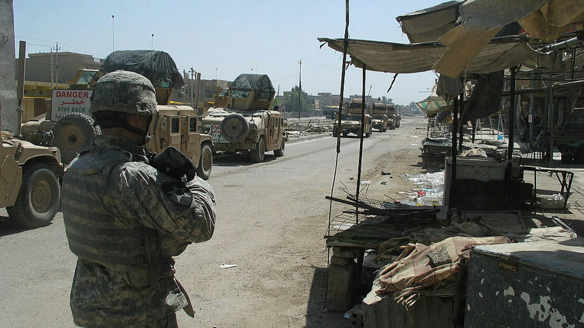 A U.S. soldier patrols a market in eastern Baghdad.