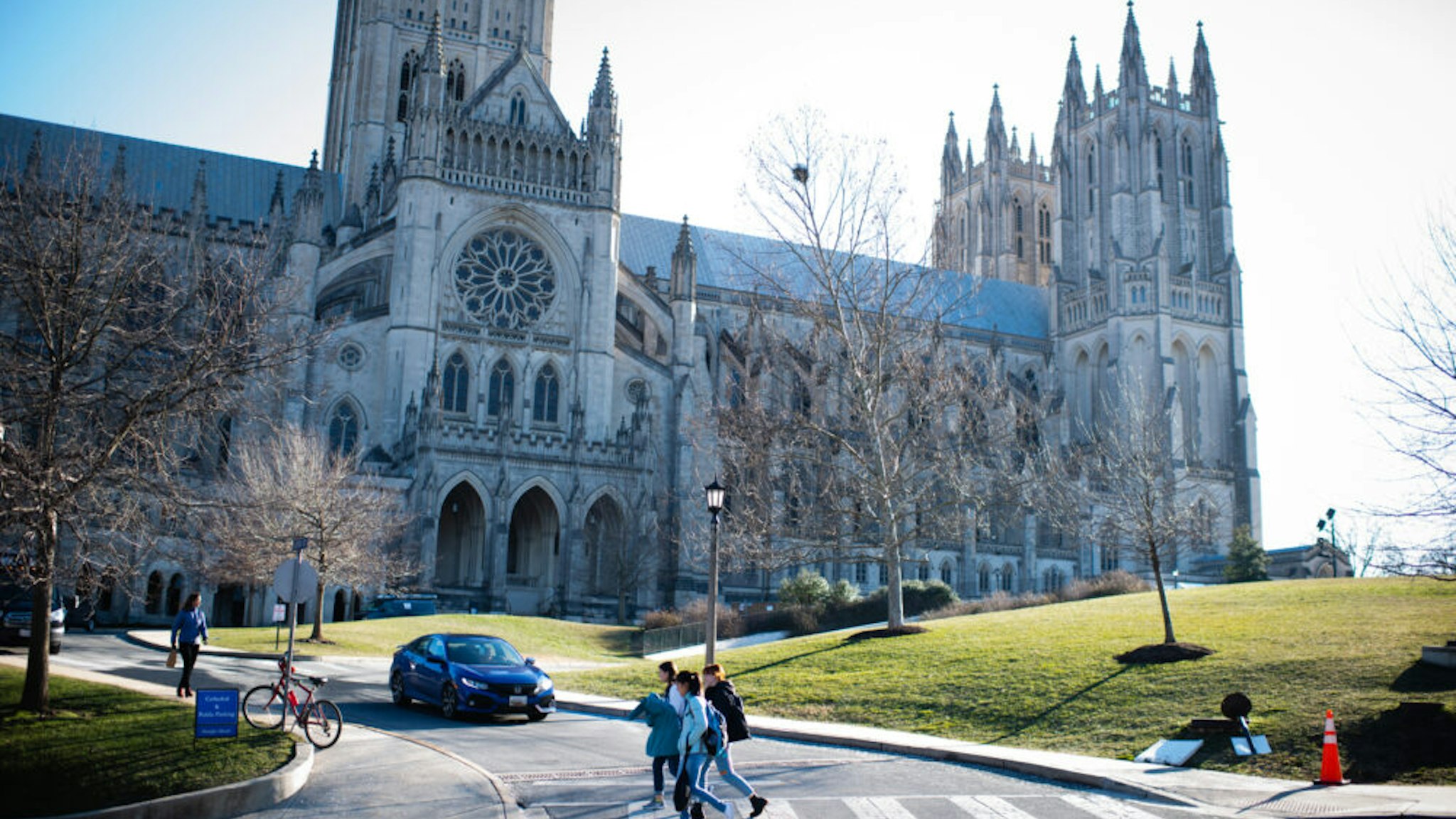 WASHINGTON, DC - JANUARY 25: People walk near Washington National Cathedral. Massachusetts Avenue Heights is a neighborhood in DC that is bounded to the north by Woodley Road, to the southwest by Massachusetts Avenue, to the east by 34th Street NW, and to the west by Wisconsin Avenue. (Photo by Sarah L. Voisin/The Washington Post via Getty Images)