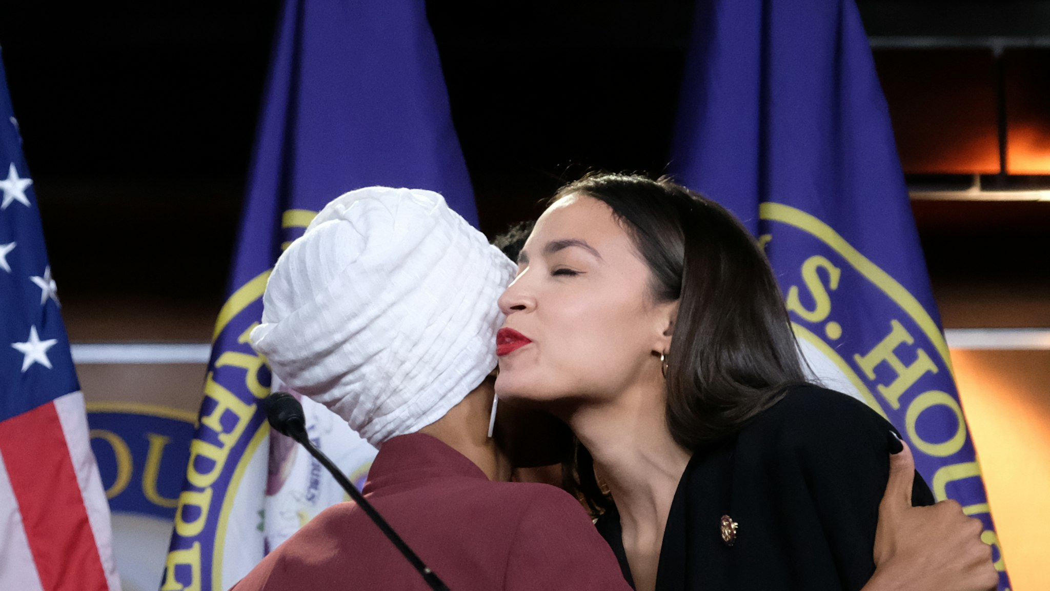WASHINGTON, DC - JULY 15: U.S. Rep. Ilhan Omar (D-MN) and Rep. Alexandria Ocasio-Cortez (D-NY), hug between answering questions during a press conference at the U.S. Capitol, on July 15, 2019 in Washington, DC. President Donald Trump stepped up his attacks on four progressive Democratic congresswomen, saying if they're not happy in the United States "they can leave." (Photo by Alex Wroblewski/Getty Images)
