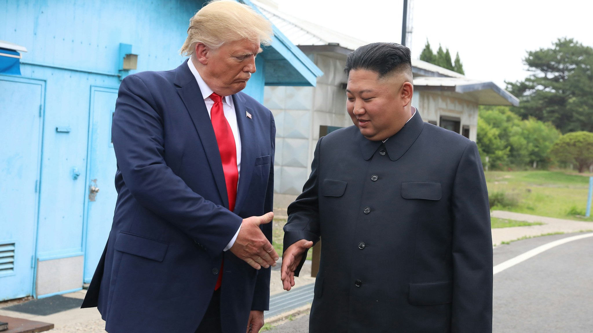 PANMUNJOM, SOUTH KOREA - JUNE 30 (SOUTH KOREA OUT): A handout photo provided by Dong-A Ilbo of North Korean leader Kim Jong Un and U.S. President Donald Trump inside the demilitarized zone (DMZ) separating the South and North Korea on June 30, 2019 in Panmunjom, South Korea. U.S. President Donald Trump and North Korean leader Kim Jong-un briefly met at the Korean demilitarized zone (DMZ) on Sunday, with an intention to revitalize stalled nuclear talks and demonstrate the friendship between both countries. The encounter was the third time Trump and Kim have gotten together in person as both leaders have said they are committed to the "complete denuclearization" of the Korean peninsula. (Handout photo by Dong-A Ilbo via Getty Images/Getty Images)