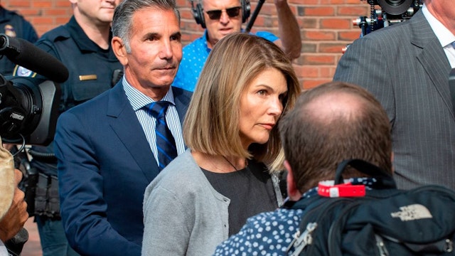 Actress Lori Loughlin and husband Mossimo Giannulli exit the Boston Federal Court house after a pre-trial hearing with Magistrate Judge Kelley at the John Joseph Moakley US Courthouse in Boston on August 27, 2019.