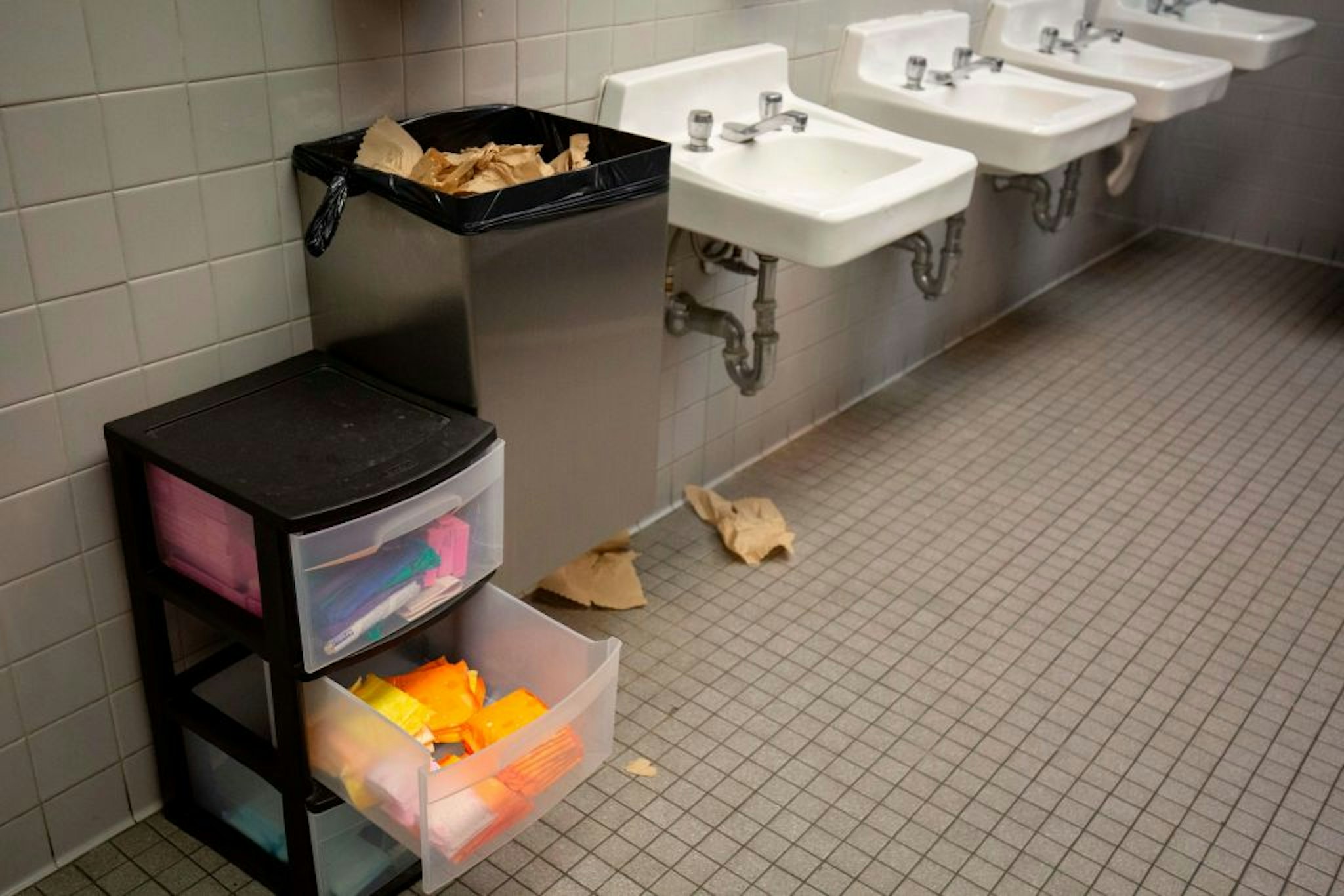 Free pads and tampons are seen in a bathroom at Justice High School in Falls Church, Virginia, on September 11, 2019.