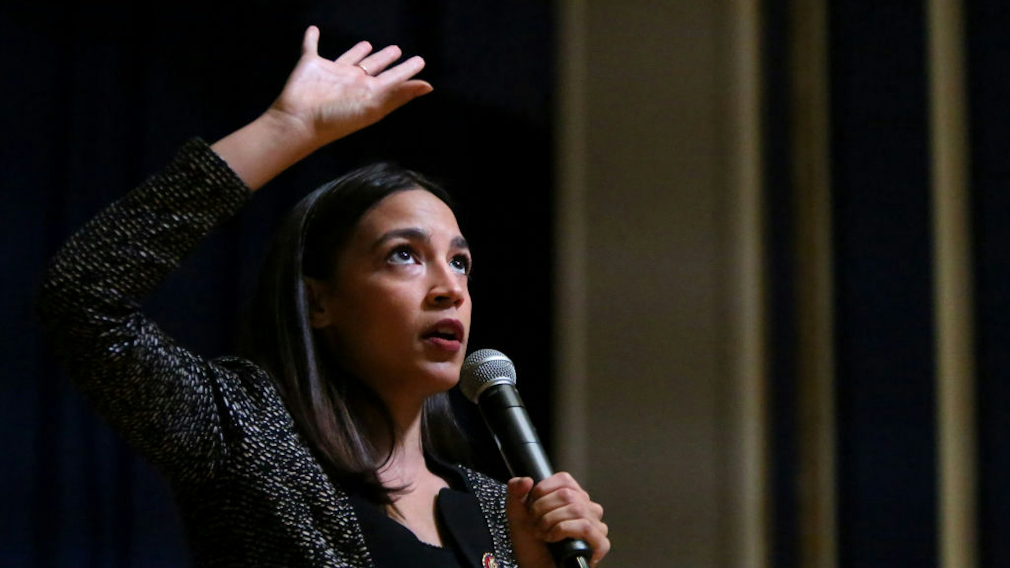 Rep. Alexandria Ocasio-Cortez (D-NY) speaks during a Green New Deal For Public Housing Town Hall on December 14, 2019 in the Queens borough of New York City.