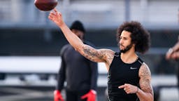 Colin Kaepernick RIVERDALE, GA - NOVEMBER 16: Colin Kaepernick looks to pass during his NFL workout held at Charles R Drew high school on November 16, 2019 in Riverdale, Georgia.