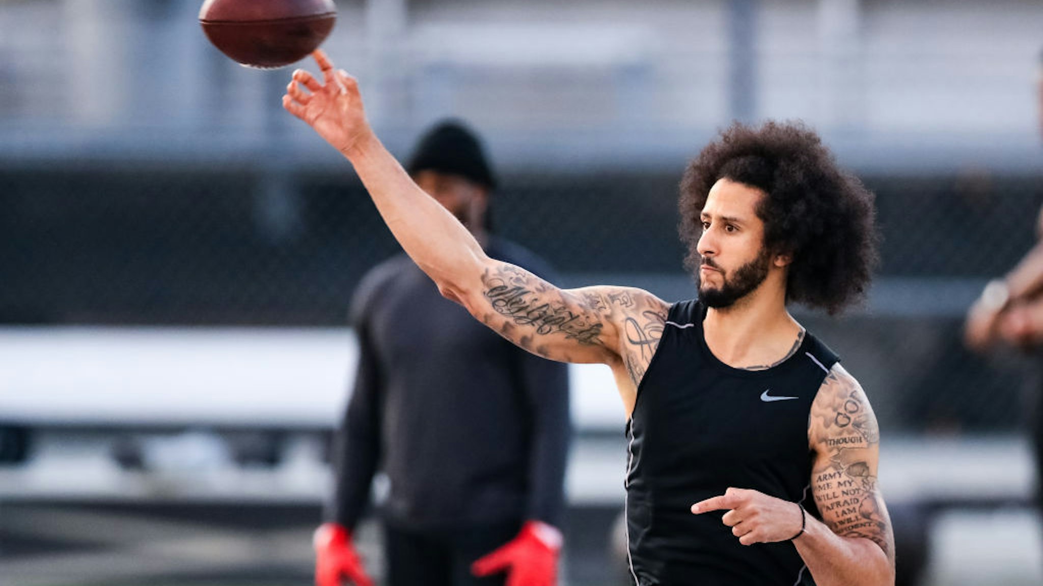Colin Kaepernick looks to pass during his NFL workout held at Charles R Drew high school on November 16, 2019 in Riverdale, Georgia.