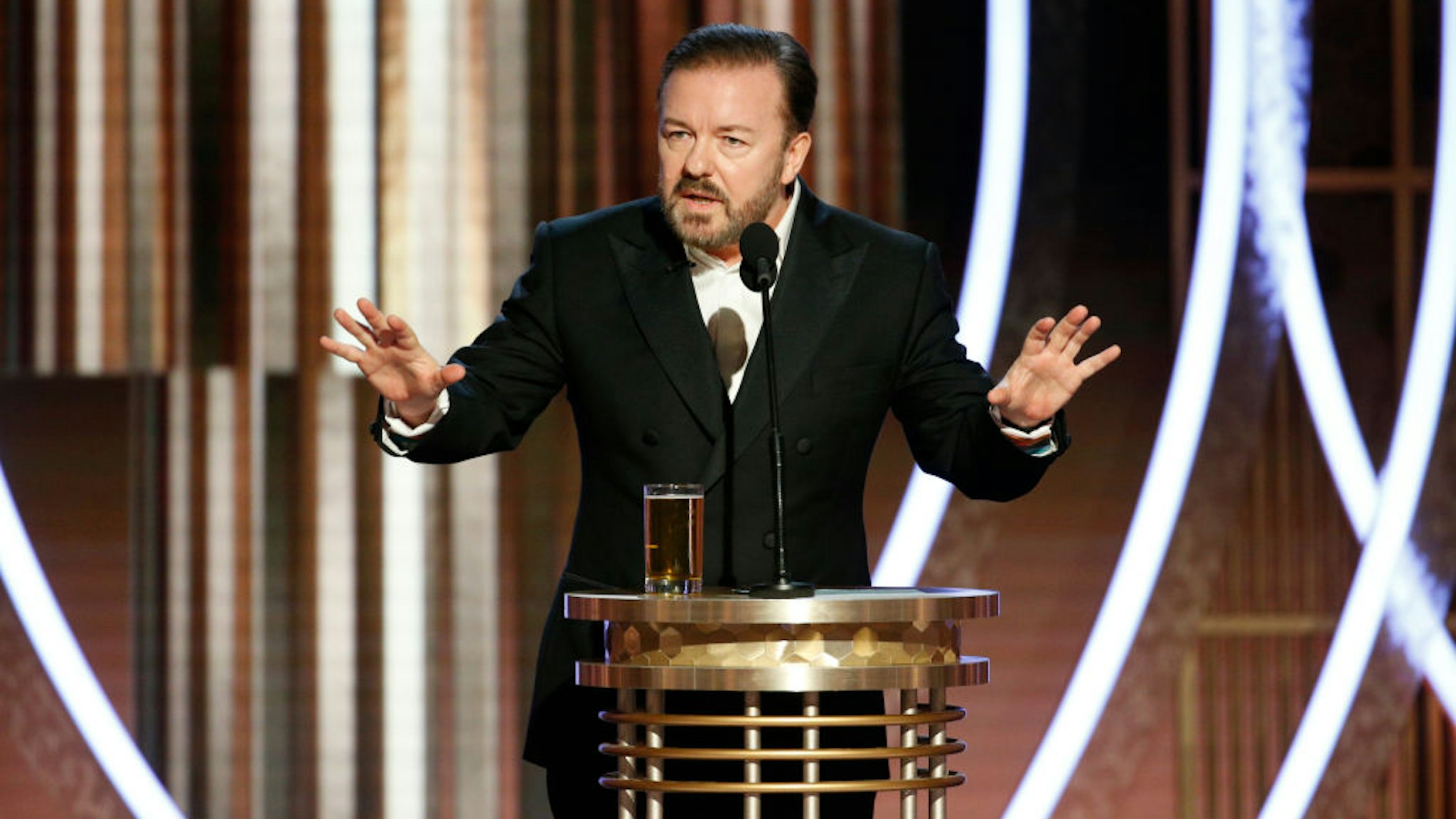 BEVERLY HILLS, CALIFORNIA - JANUARY 05: In this handout photo provided by NBCUniversal Media, LLC, host Ricky Gervais speaks onstage during the 77th Annual Golden Globe Awards at The Beverly Hilton Hotel on January 5, 2020 in Beverly Hills, California.