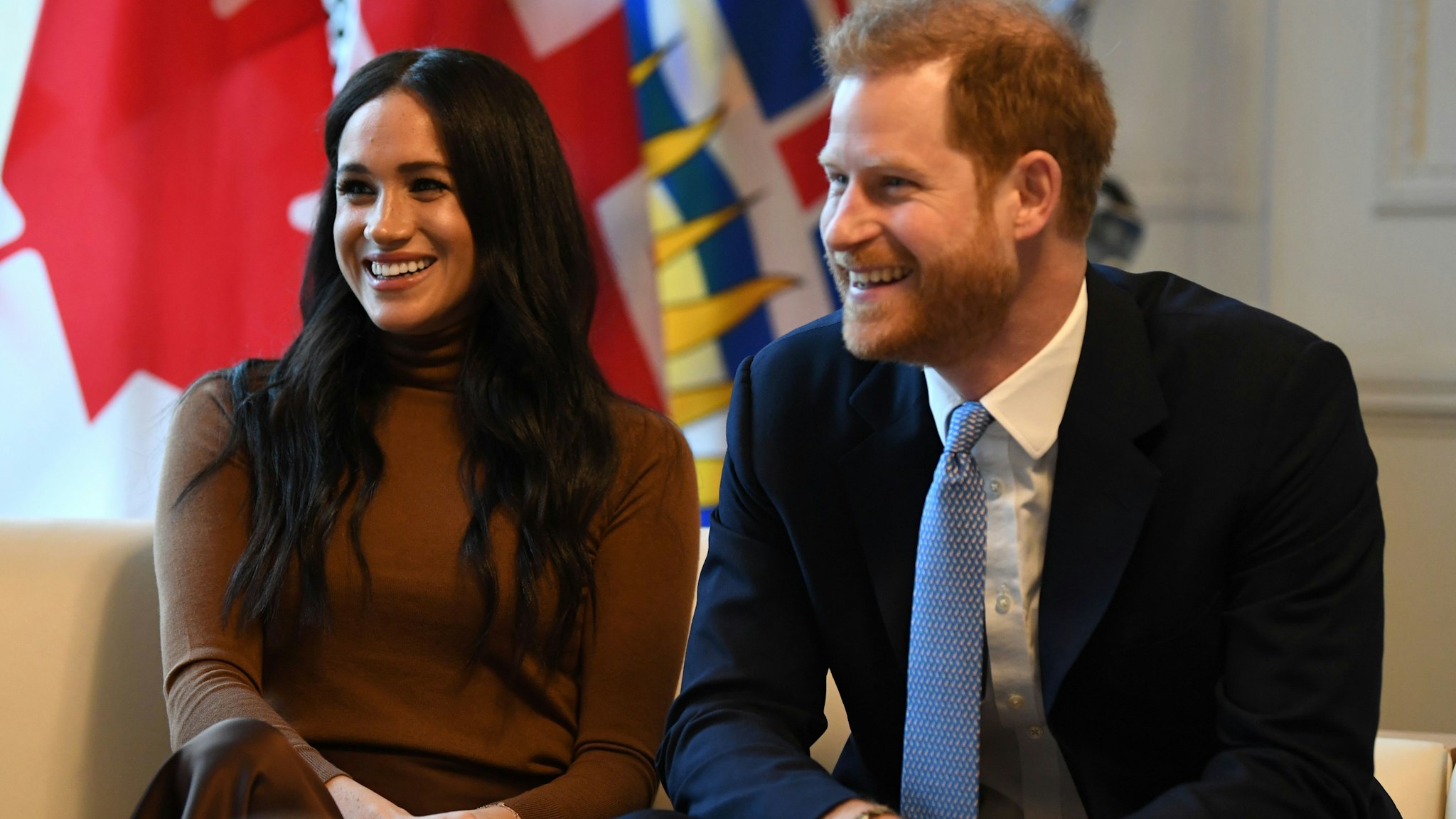 Britain's Prince Harry, Duke of Sussex and Meghan, Duchess of Sussex react during their visit to Canada House in thanks for the warm Canadian hospitality and support they received during their recent stay in Canada, in London on January 7, 2020. (Photo by DANIEL LEAL-OLIVAS / POOL / AFP) (Photo by DANIEL LEAL-OLIVAS/POOL/AFP via Getty Images)