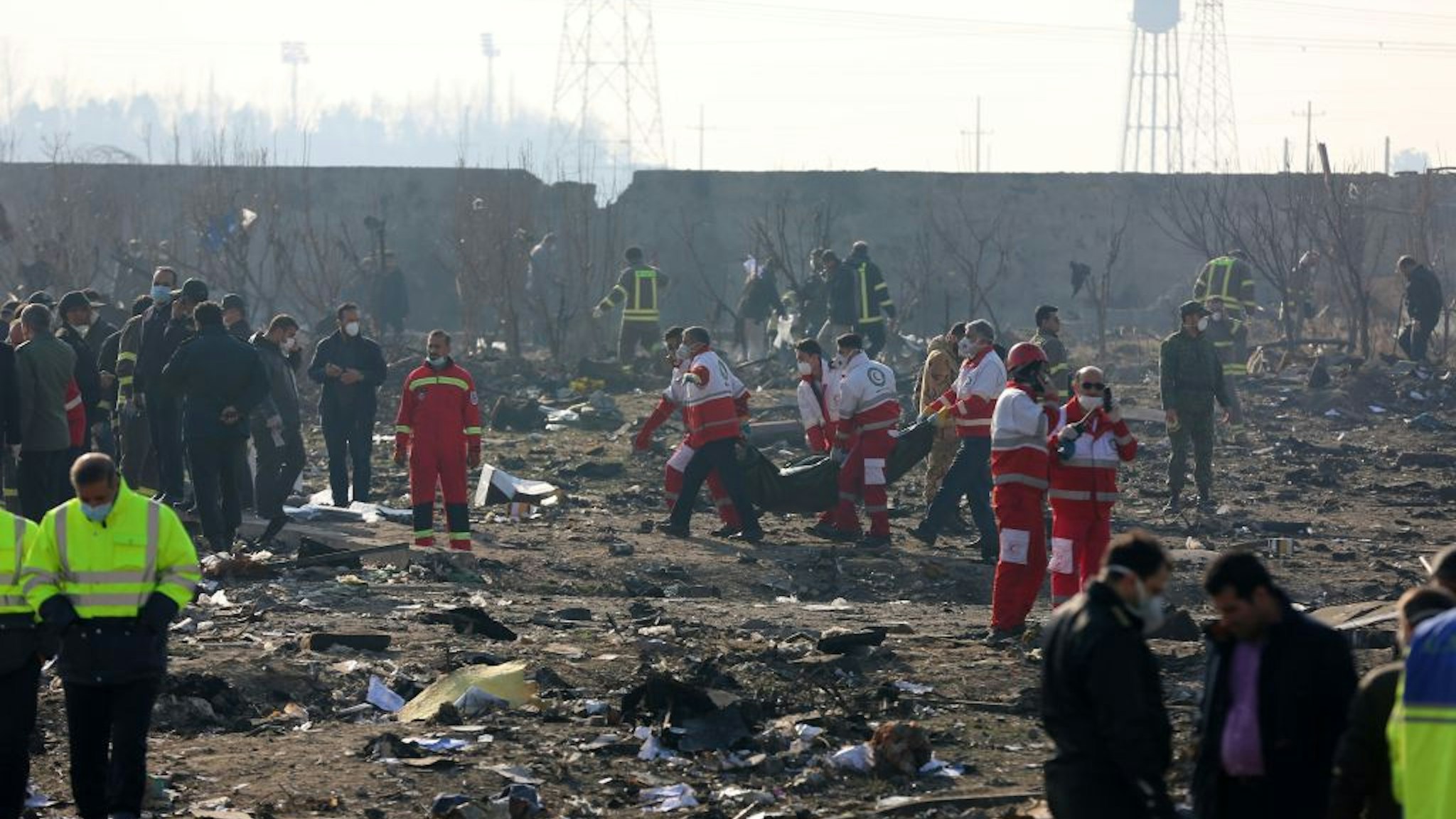 TEHRAN, IRAN - JANUARY 08: Search and rescue works are conducted at site after a Boeing 737 plane belonging to a Ukrainian airline crashed near Imam Khomeini Airport in Iran just after takeoff with 180 passengers on board in Tehran, Iran on January 08, 2020. All 167 passengers and nine crew members on an Ukrainian 737 plane that crashed near Iran's capital Tehran early Wednesday have died, according to a state official.