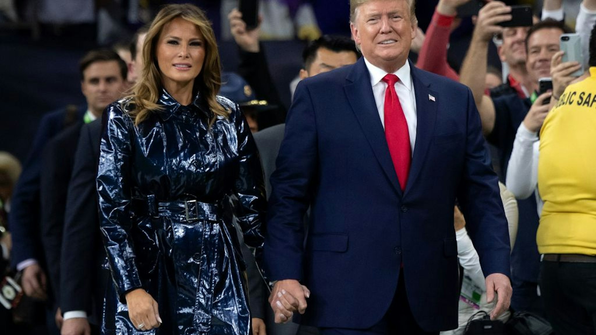 US President Donald Trump and First Lady Melania Trump attend the College Football Playoff National Championship game at the Mercedes-Benz Superdome in New Orleans, Louisiana, January 13, 2020.