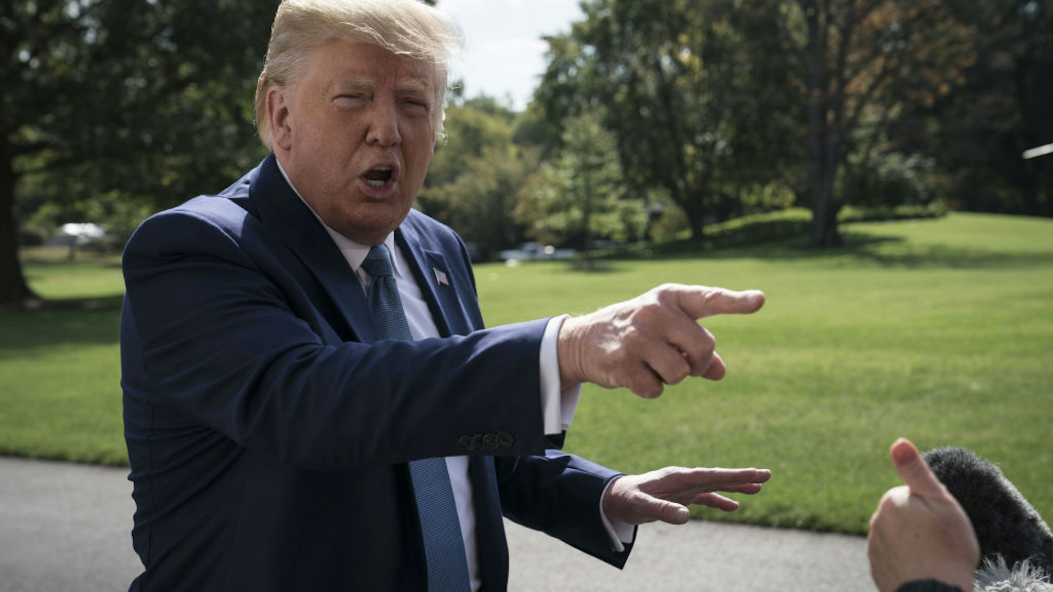 President Donald Trump speaks to members of the media outside of the White House in Washington, D.C., U.S., on Friday, Oct. 4, 2019.