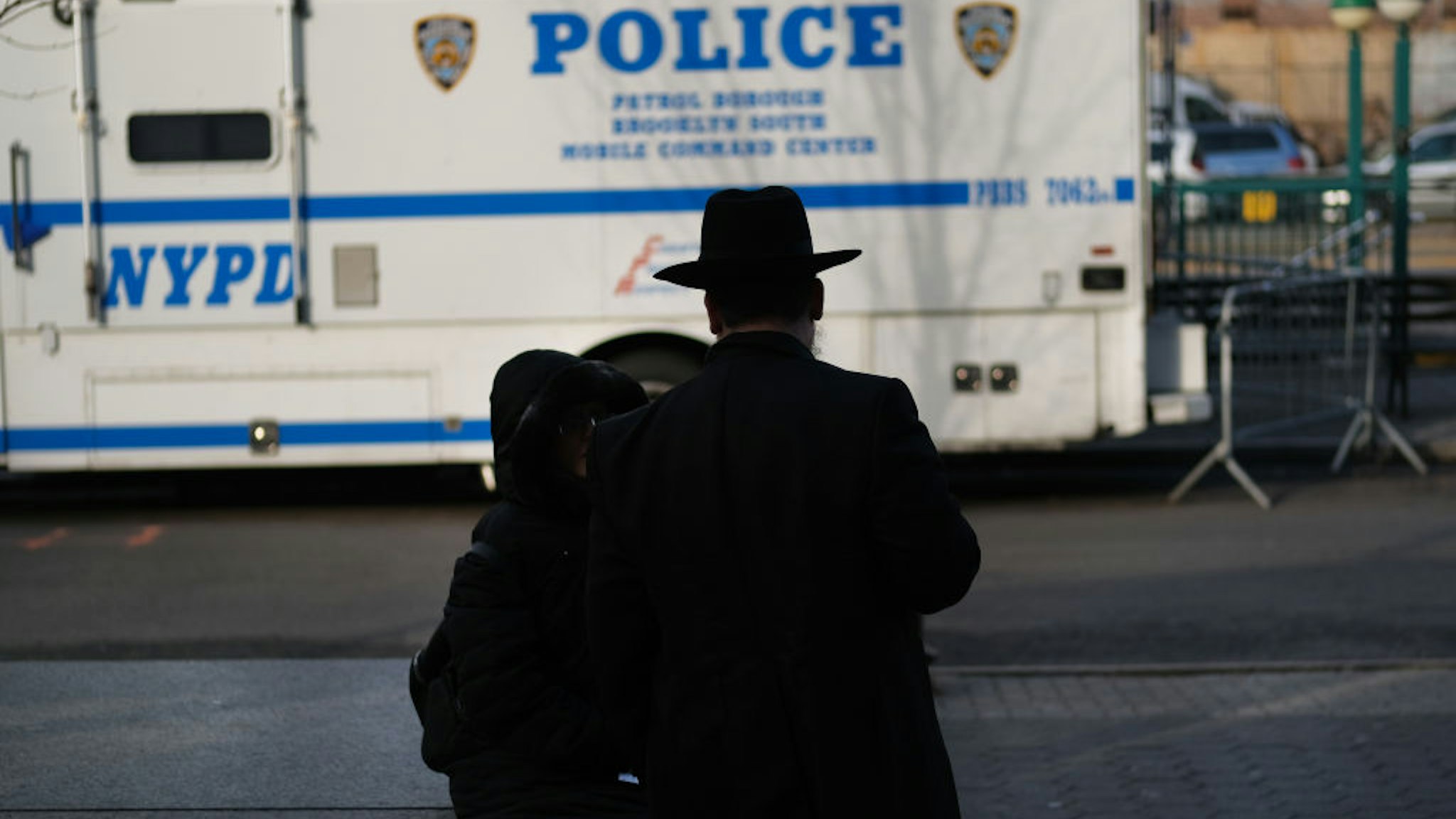 NEW YORK, NEW YORK - DECEMBER 31: People walk through the Orthodox Jewish section of the Crown Heights neighborhood in Brooklyn on December 31, 2019 in New York City. Five Orthodox Jews were stabbed at a synagogue on Saturday evening in the upstate New York town of Monsey. Tensions remain high in Jewish communities following a series of attacks and incidents in recent weeks.