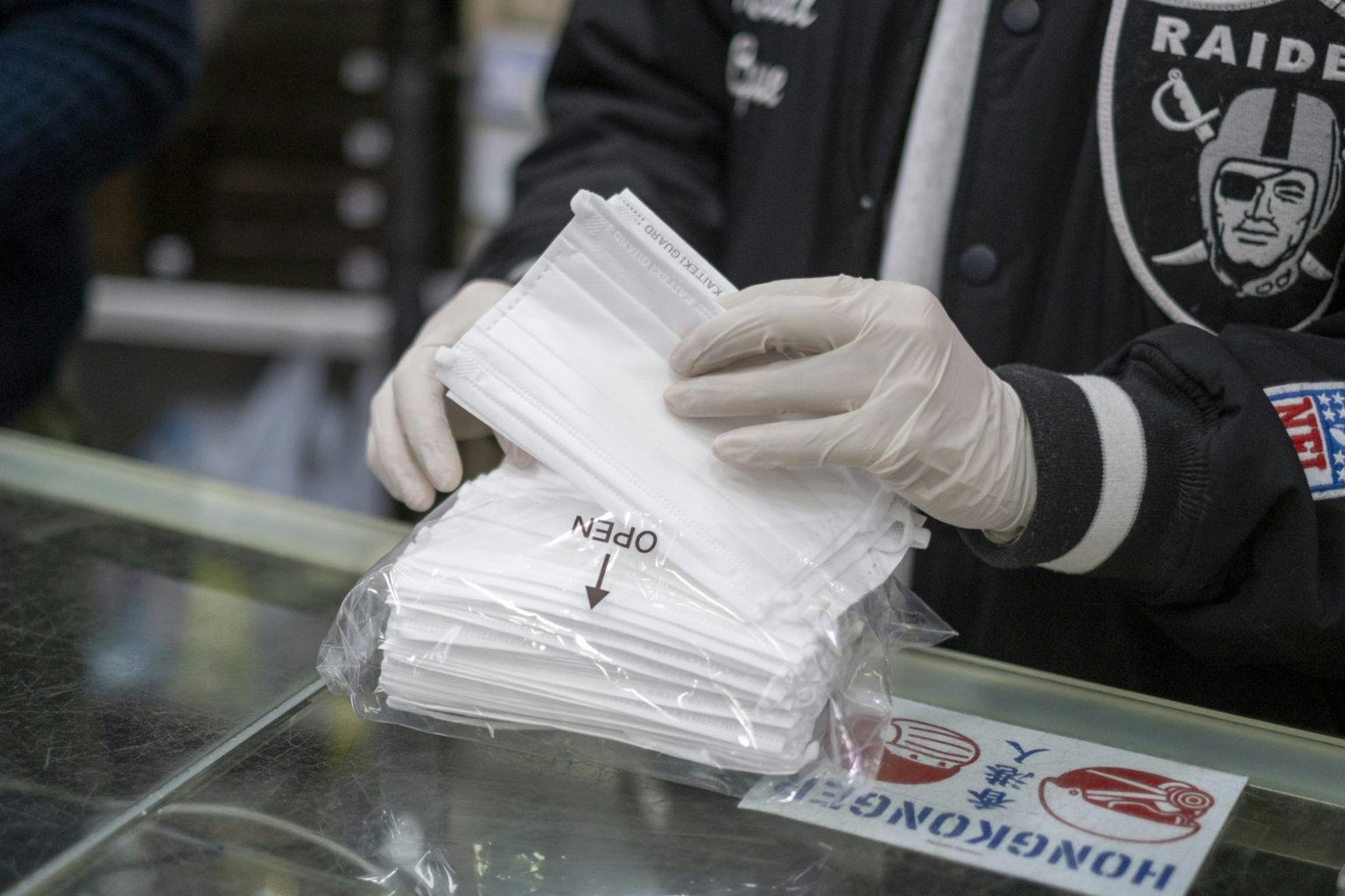 An employee prepares to distribute free protective masks at a pharmacy in Hong Kong, China, on Tuesday, Jan. 28, 2020. China restricted travel to Hong Kong as governments, global companies and international health organizations rushed to contain a SARS-like coronavirus that has claimed more than 100 lives. Photographer: Justin Chin/Bloomberg via Getty Images