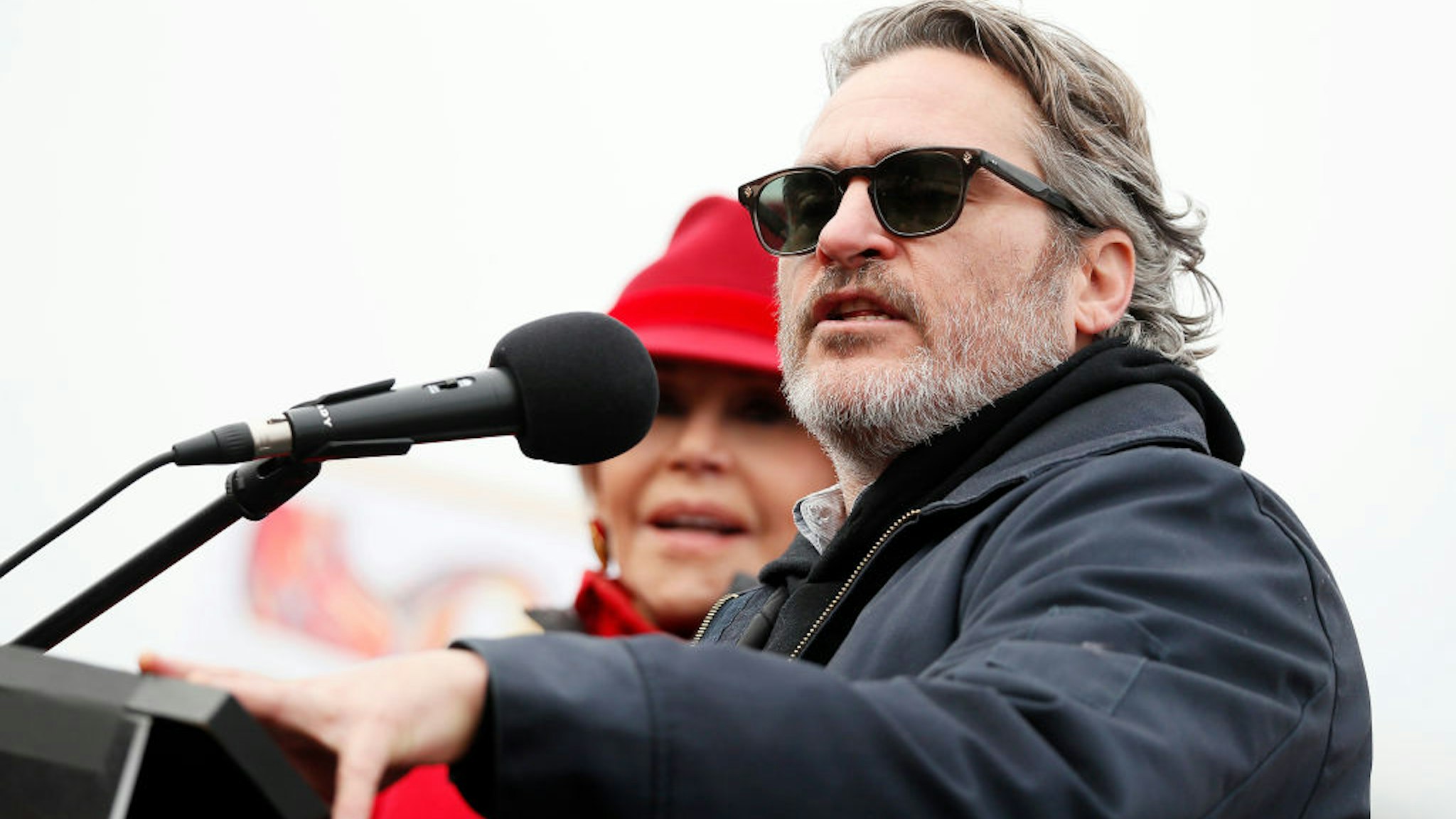 Actor Joaquin Phoenix (R) onstage with actress and activist Jane Fond during the last "Fire Drill Fridays" climate change protest and rally on Capitol Hill on January 10, 2020 in Washington, DC.