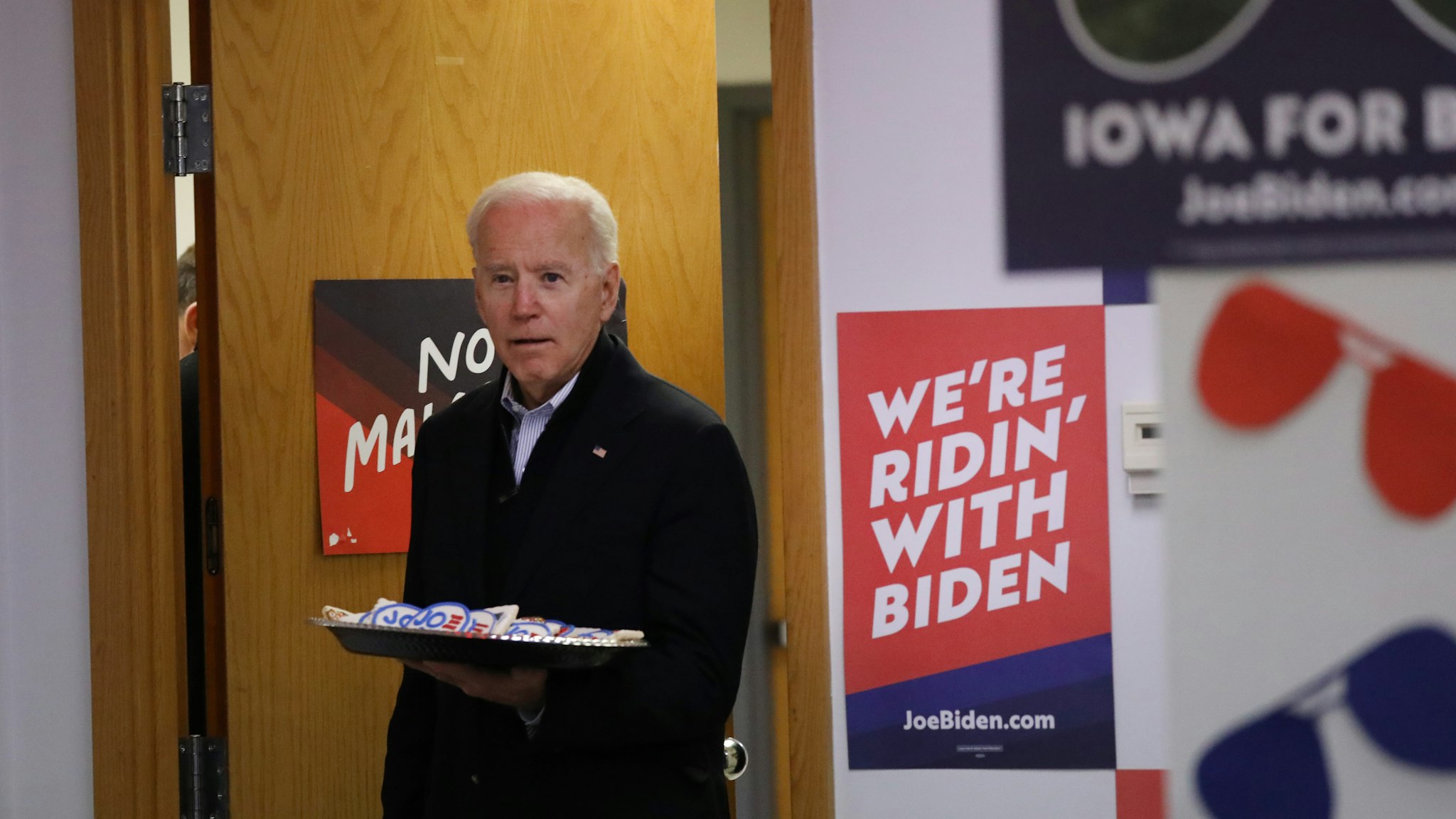 DES MOINES, IOWA - JANUARY 13: Democratic presidential candidate, former Vice President Joe Biden greets volunteers at state campaign headquarters on January 13, 2020 in Des Moines, Iowa. A new poll by Monmouth University released today shows Biden atop the Democratic field in Iowa with 24 percent of the vote, six points in front of Sen. Bernie Sanders (I-VT) ahead of next month’s caucuses. (Photo by Spencer Platt/Getty Images)