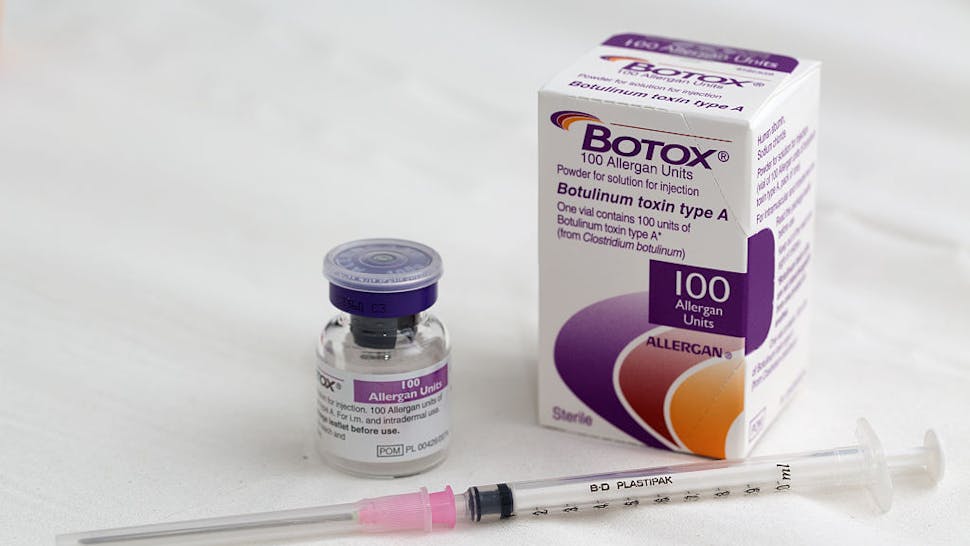 Allergan Inc.’s Botox Cosmetic As Actavis Plc Buys Drugmaker For $66 Billion A syringe rests alongside a vial of Allergan Botox, produced by Allergan Inc., in this arranged photograph taken at a skin and beauty clinic in London, U.K., on Monday, Nov. 17, 2014.