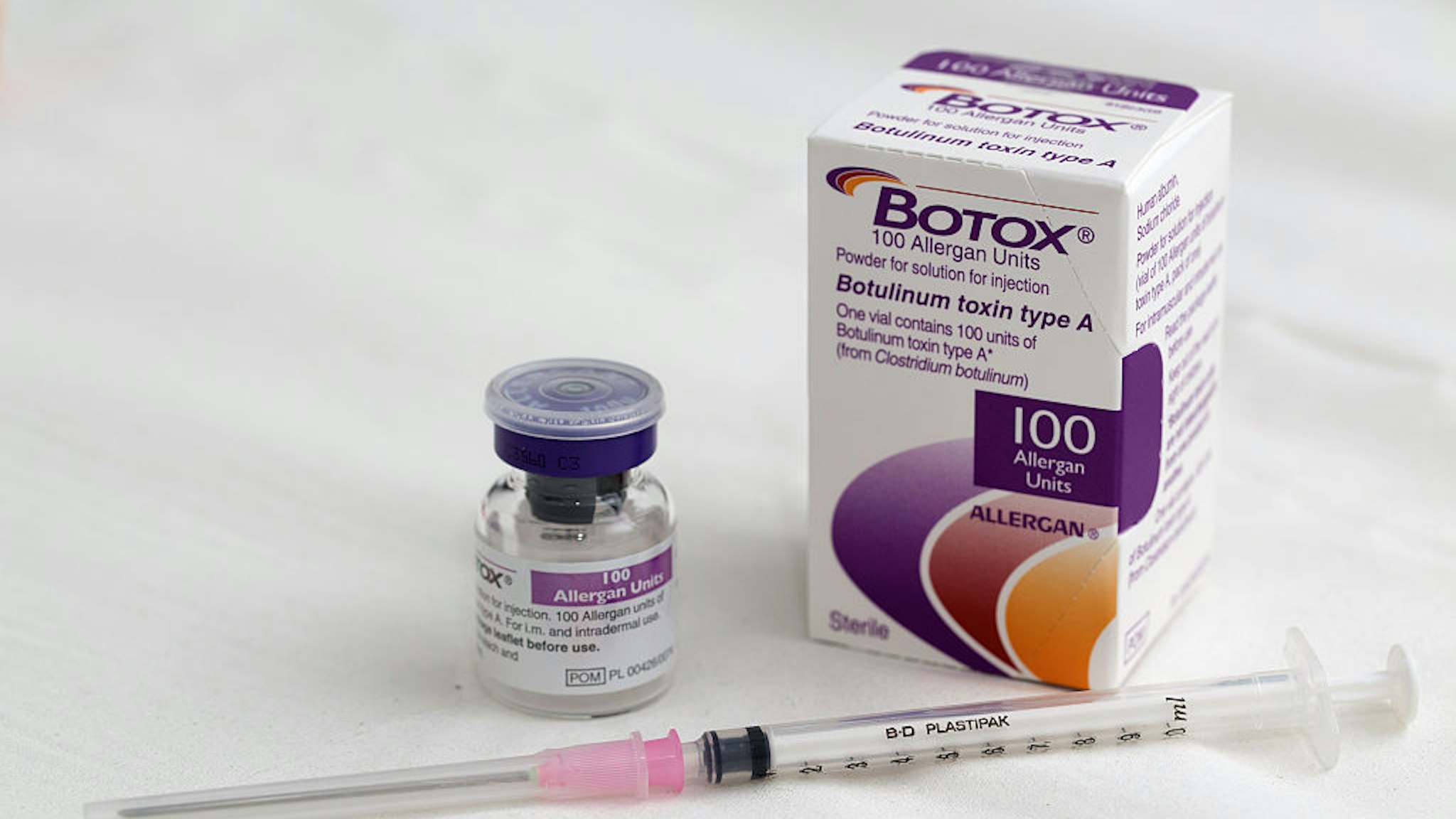 A syringe rests alongside a vial of Allergan Botox, produced by Allergan Inc., in this arranged photograph taken at a skin and beauty clinic in London, U.K., on Monday, Nov. 17, 2014.