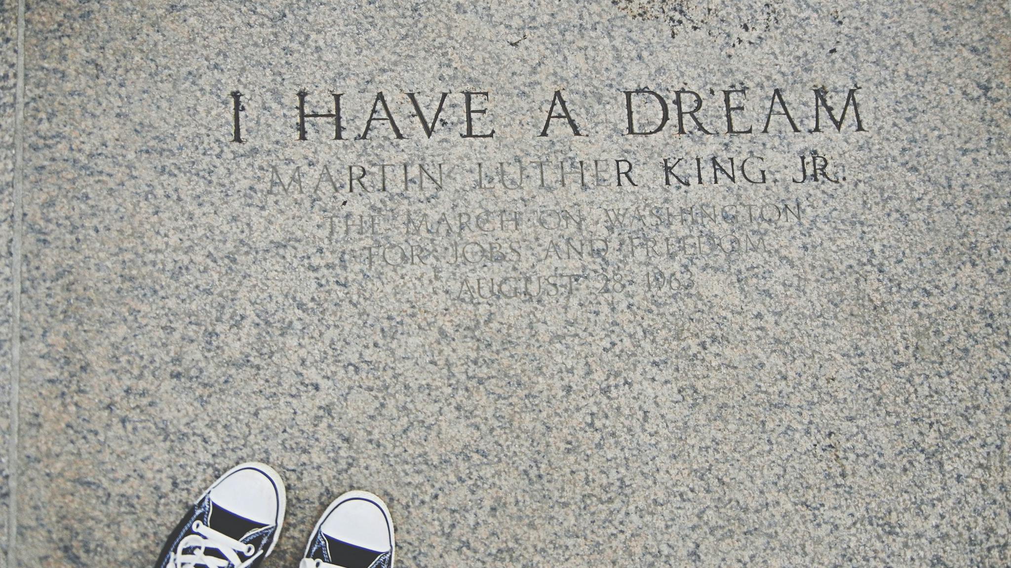 Low section of person standing on engraved floor MLK