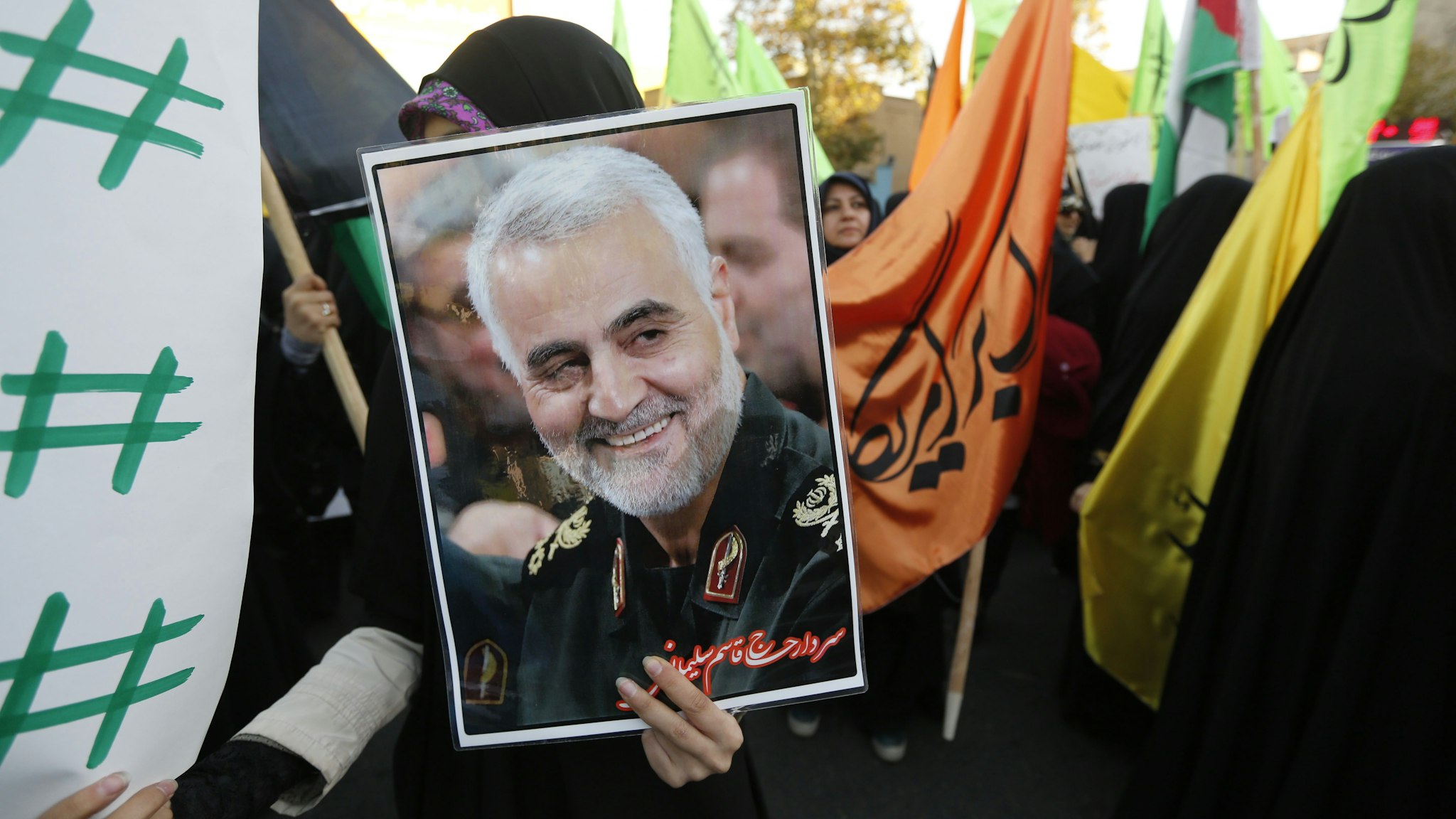 Iranian protesters hold a portrait of the commander of the Iranian Revolutionary Guard's Quds Force, Gen. Qassem Soleimani, during a demonstration in the capital Tehran on December 11, 2017, to denounce US President Donald Trump's declaration of Jerusalem as Israel's capital. (Photo by ATTA KENARE / AFP) (Photo by ATTA KENARE/AFP via Getty Images)