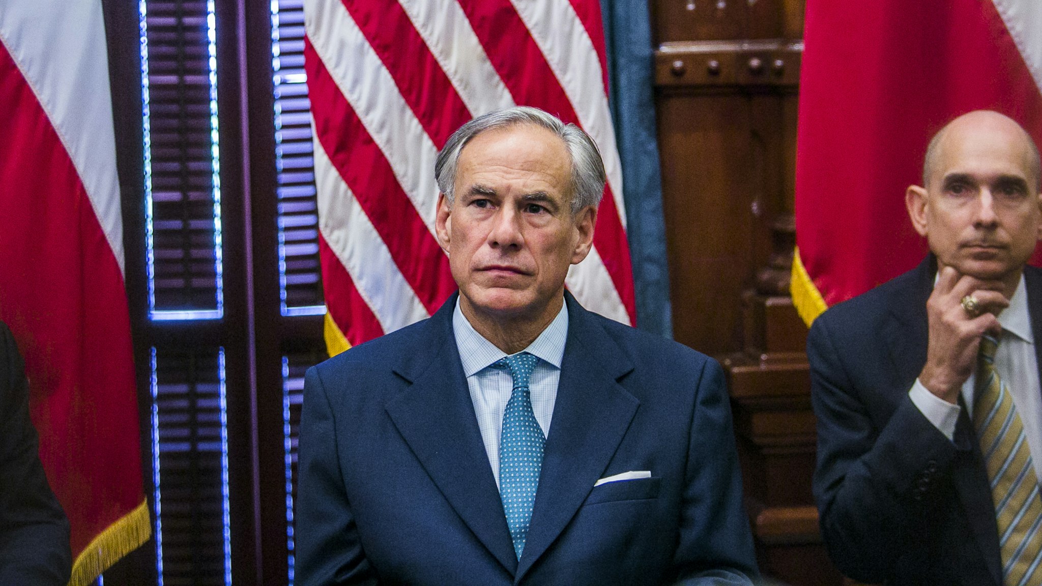 AUSTIN, TX - MAY 24: Texas Governor Greg Abbott (C) holds a roundtable discussion with victims, family, and friends affected by the Santa Fe, Texas school shooting at the state capital on May 24, 2018 in Austin, Texas. Representatives from Sutherland Springs, Alpine, and Killeen were also invited and address the governor.