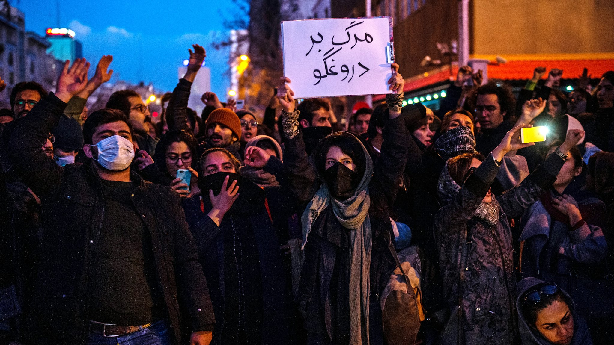 Demonstrators chant while gathering during a vigil for the victims of the Ukraine International Airlines flight that was unintentionally shot down by Iran, in Tehran, Iran, on Saturday, Jan. 11, 2019. Iran admitted it unintentionally shot down a Ukrainian jetliner that it mistook for a cruise missile, a dramatic reversal after days of denials that triggered international condemnation and protests in the streets of Tehran.