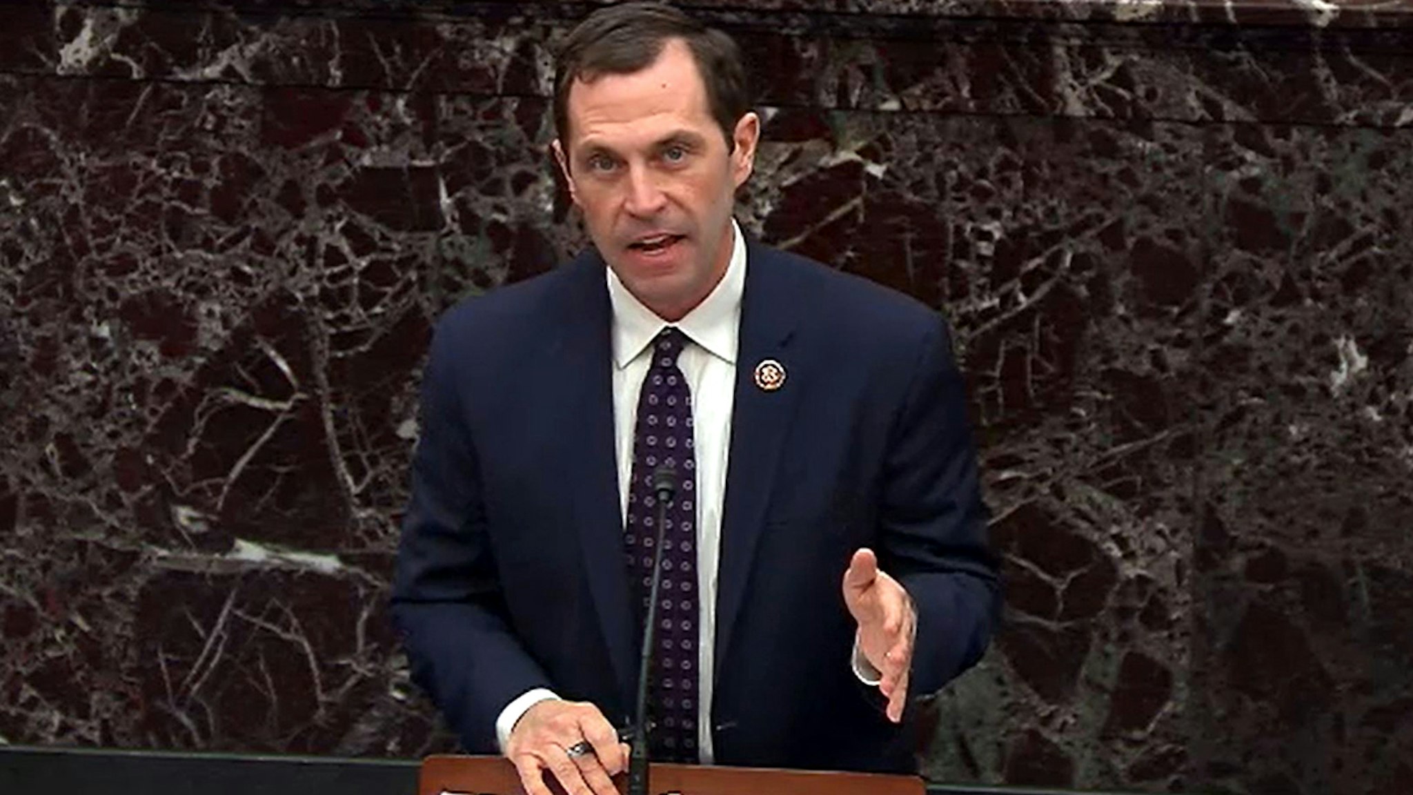 WASHINGTON, DC - JANUARY 22: In this screengrab taken from a Senate Television webcast, House impeachment manager Rep. Jason Crow (D-CO) speaks during impeachment proceedings against U.S. President Donald Trump in the Senate at the U.S. Capitol on January 22, 2020 in Washington, DC.