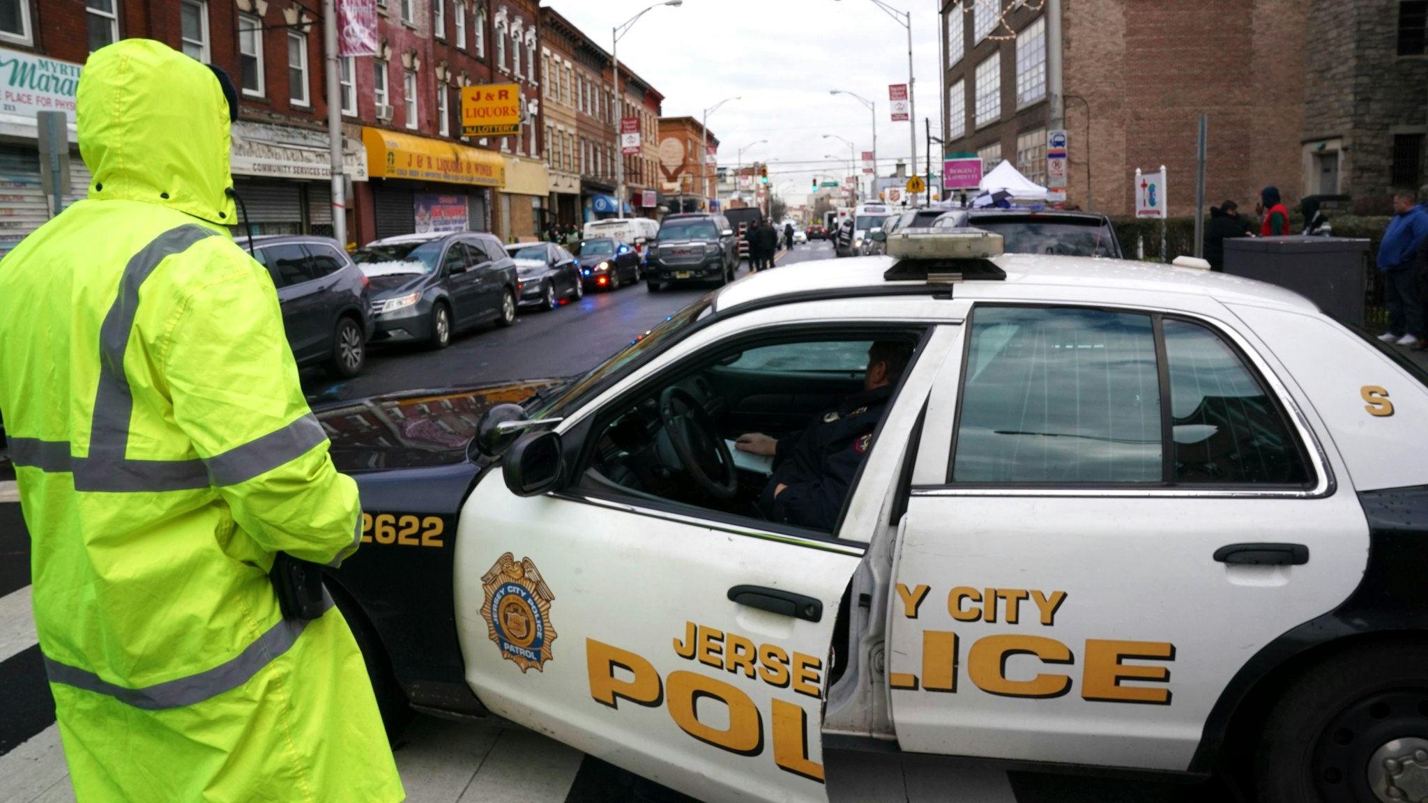 Jersey City Police gather at the scene of the December 10, 2019 shooting at a Jewish Deli on December 11, 2019 in Jersey City, New Jersey. - The shooters who unleashed a deadly firefight in Jersey City deliberately targeted a kosher grocery, the city's mayor said December 11, 2019, suggesting that it was an anti-Semitic attack."Last night after extensive review of our CCTV system it has now become clear from the cameras that these two individuals targeted the Kosher grocery," wrote Jersey City Mayor Steven Fulop on Twitter.