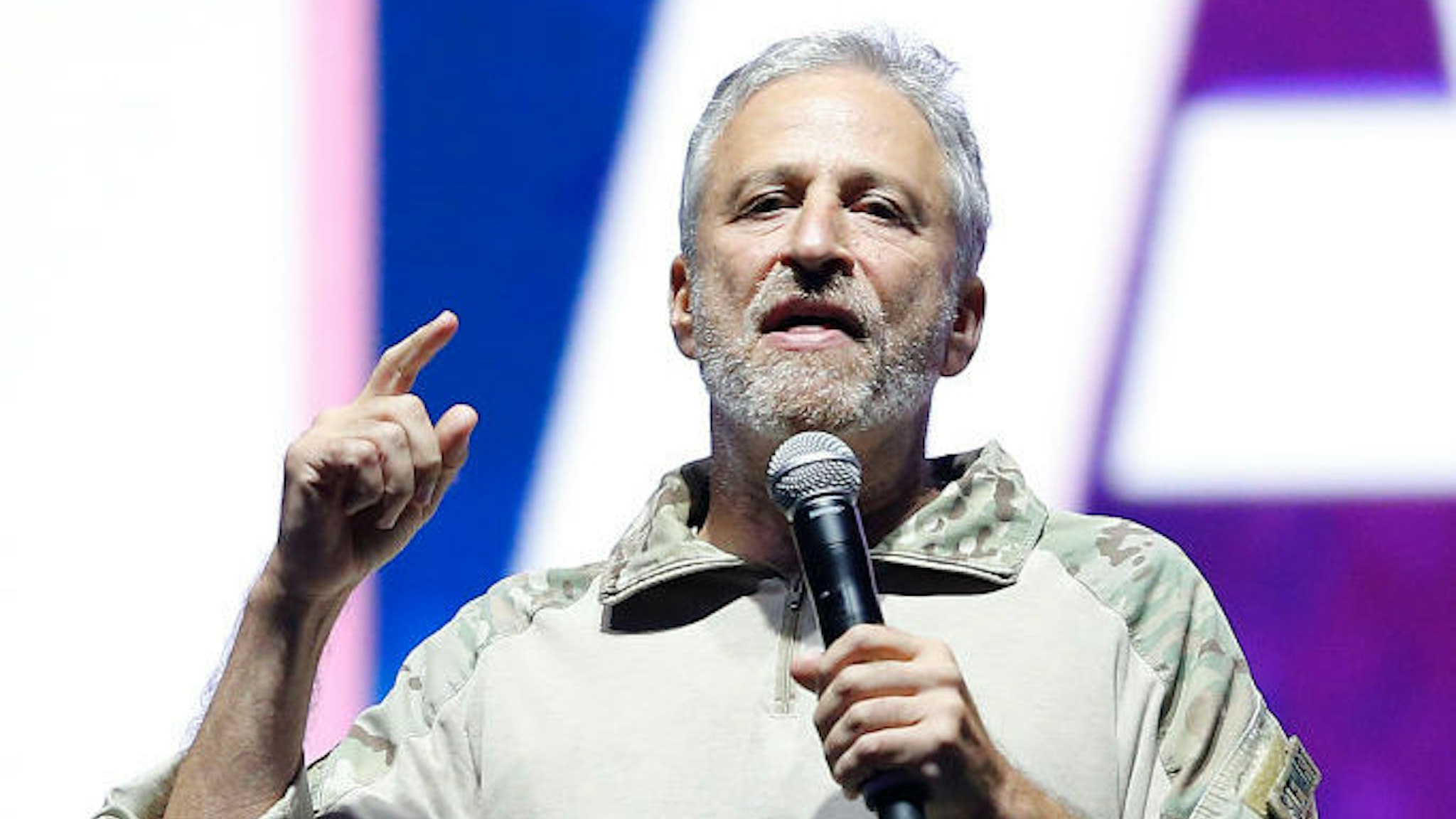 Jon Stewart speaks on stage during the opening ceremony of the 2019 Warrior Games at Amalie Arena on June 22, 2019 in Tampa, Florida. (Photo by Michael Reaves/Getty Images)