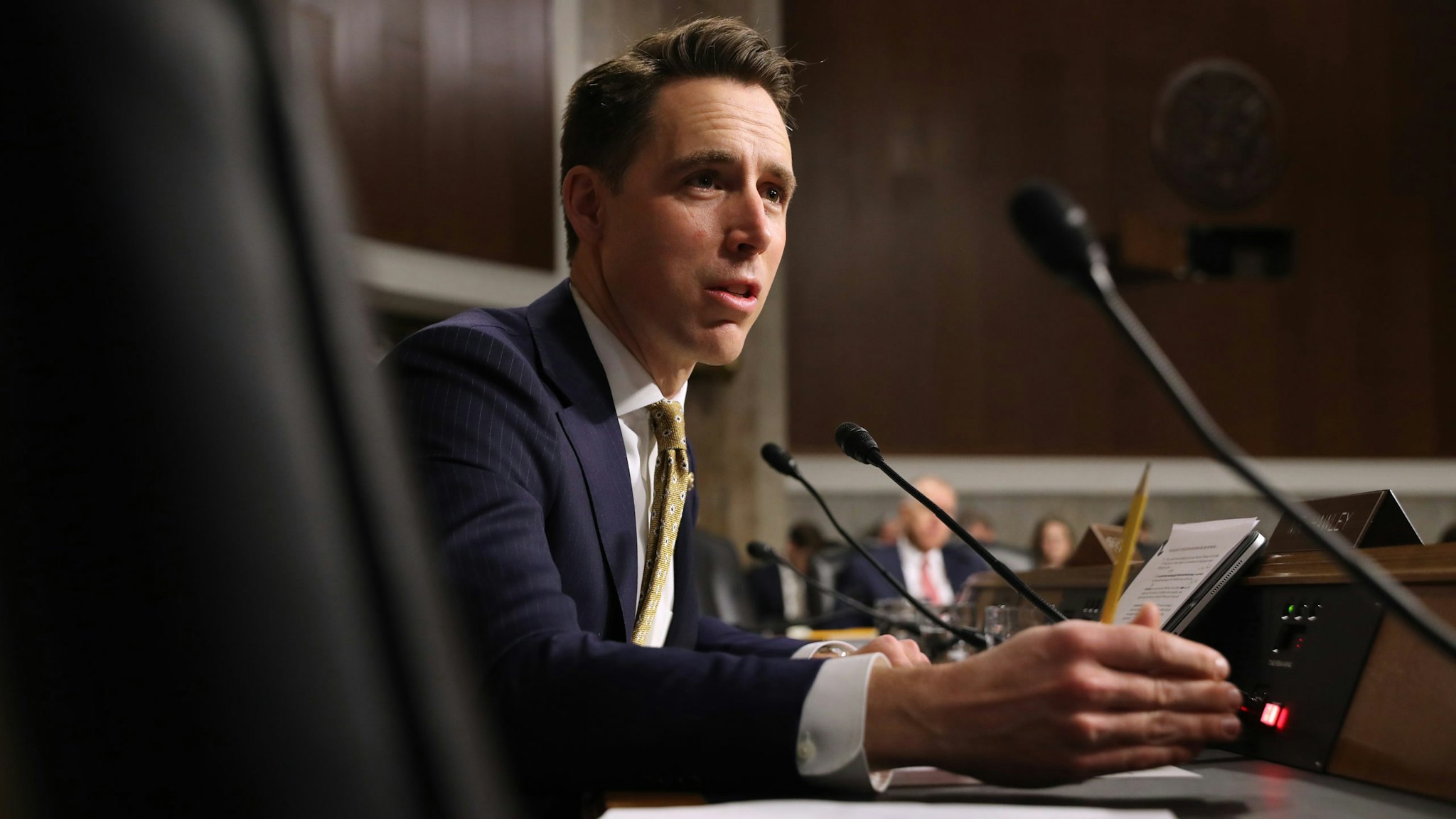 WASHINGTON, DC - DECEMBER 03: Senate Armed Services Committee member Sen. Josh Hawley (R-OM) questions witnesses during a hearing in the Dirksen Senate Office Building on Capitol Hill December 03, 2019 in Washington, DC. Military secretaries and members of the Joint Chiefs testified about a new GAO report about ongoing reports of substandard military housing conditions and services.