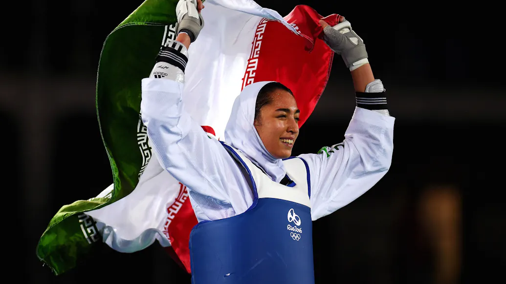 Iran’s Only Female Olympic Medal Winner Defects From Country, Blasts Regime In Message