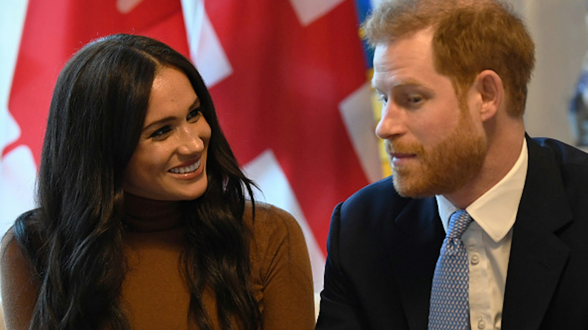 LONDON, UNITED KINGDOM - JANUARY 07: Prince Harry, Duke of Sussex and Meghan, Duchess of Sussex gesture during their visit to Canada House in thanks for the warm Canadian hospitality and support they received during their recent stay in Canada, on January 7, 2020 in London, England.