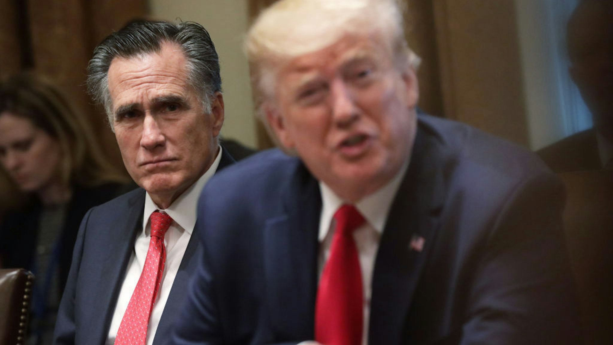 U.S. Sen. Mitt Romney (R-UT) listens as President Donald Trump speaks during a listening session on youth vaping of electronic cigarette on November 22, 2019 in the Cabinet Room of the White House in Washington, DC. President Trump met with business and concern group leaders to discuss on how to regulate vaping products and keep youth away from them. (Photo by Alex Wong/Getty Images)