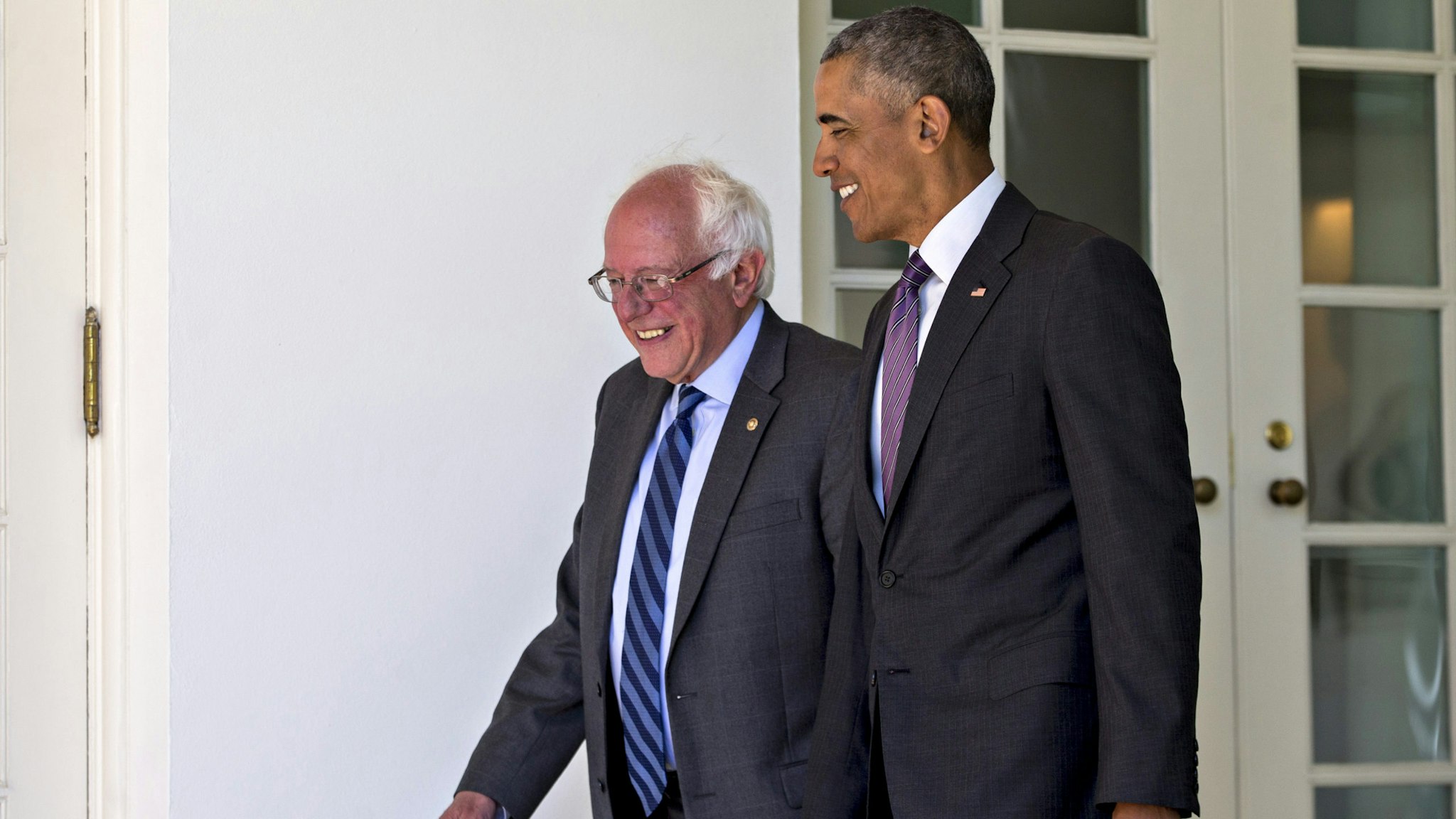 U.S. President Barack Obama, right, and Senator Bernie Sanders, an independent from Vermont and 2016 Democratic presidential candidate, walk to the Oval Office of the White House in Washington, D.C., U.S., on Thursday, June 9, 2016. Obama said yesterday he expects Democrats to unify soon behind their presumptive presidential nominee, Hillary Clinton, and that her divisive primary contest with Sanders was healthy for the party.