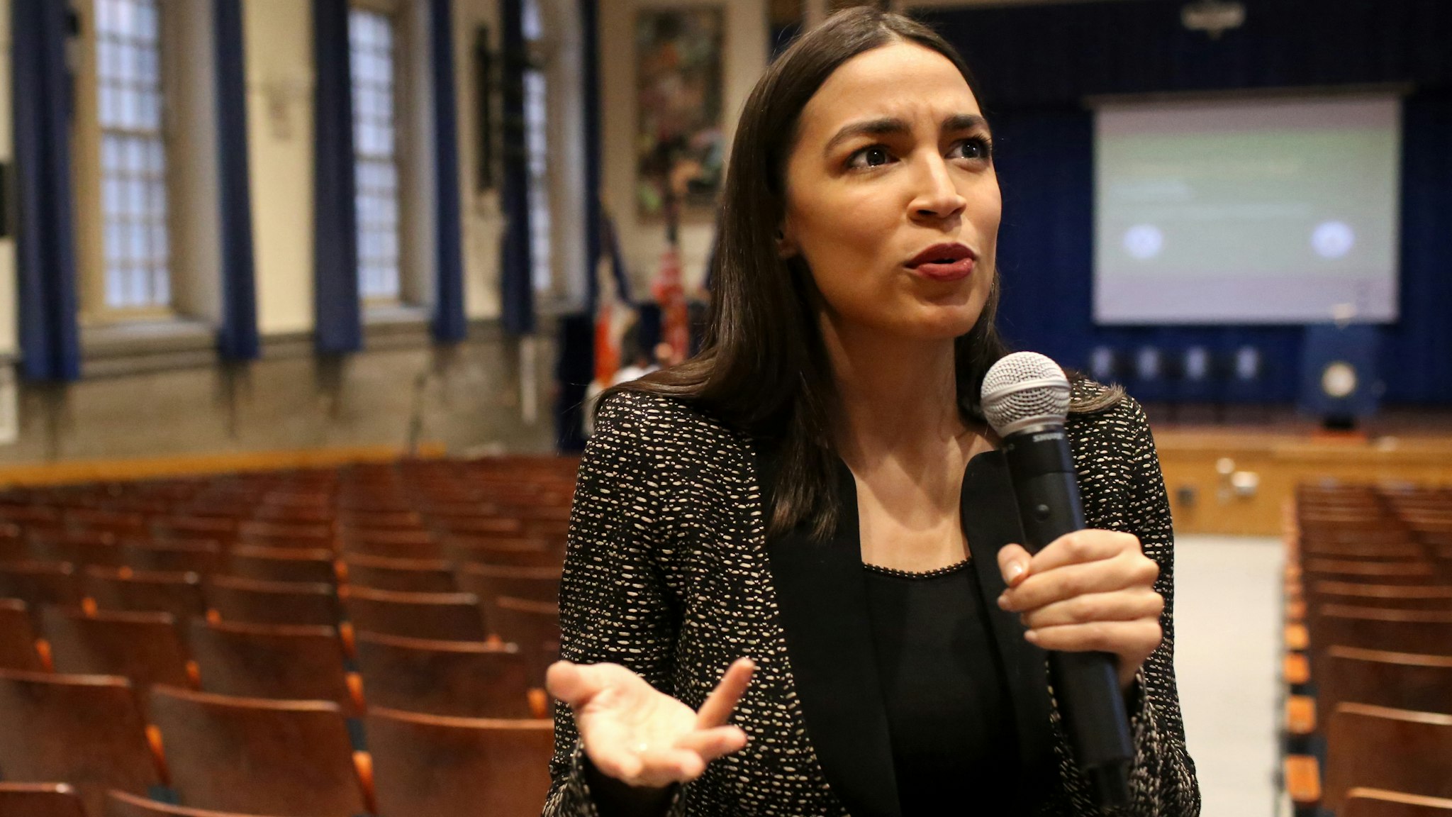 NEW YORK, NY - DECEMBER 14: U.S. Rep. Alexandria Ocasio-Cortez (D-NY) speaks with members of the media before a Green New Deal For Public Housing Town Hall on December 14, 2019 in the Queens borough of New York City. Ocasio-Cortez and Sen. Bernie Sanders (I-VT) have introduced a Green New Deal for Public Housing Act that would commit up to $180 billion over 10 years to upgrading 1.2 million federally administered homes.