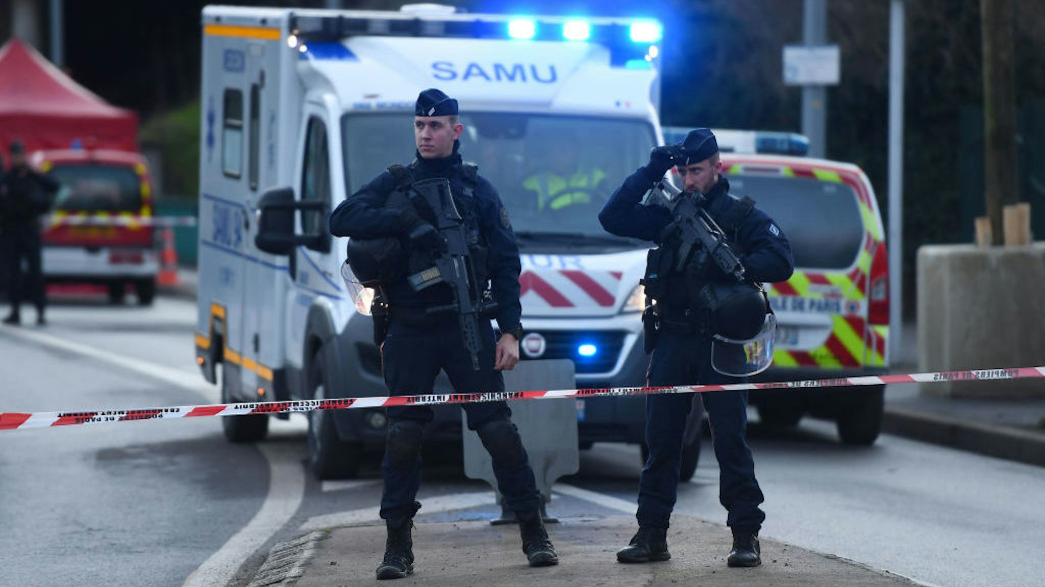 Police officers stand guard on January 3, 2020 in L'Hay-les-Roses on the site where police shot dead a knife-wielding man who killed one person and injured at least two others in a nearby park of the south of Paris' suburban city of Villejuif. - The man had attacked "several people" in a park in Villejuif before he was "neutralised", the Paris police department said. Sources close to the investigation told AFP one of the victims had later died. The attacker was shot dead by police in a neighbouring suburb. The attacker's motive has not been made clear. (Photo by CHRISTOPHE ARCHAMBAULT / AFP) (Photo by CHRISTOPHE ARCHAMBAULT/AFP via Getty Images)