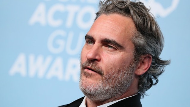 US actor Joaquin Phoenix poses with the trophy for Outstanding Performance by a Male Actor in a Leading Role in the press room during the 26th Annual Screen Actors Guild Awards at the Shrine Auditorium in Los Angeles on January 19, 2020.
