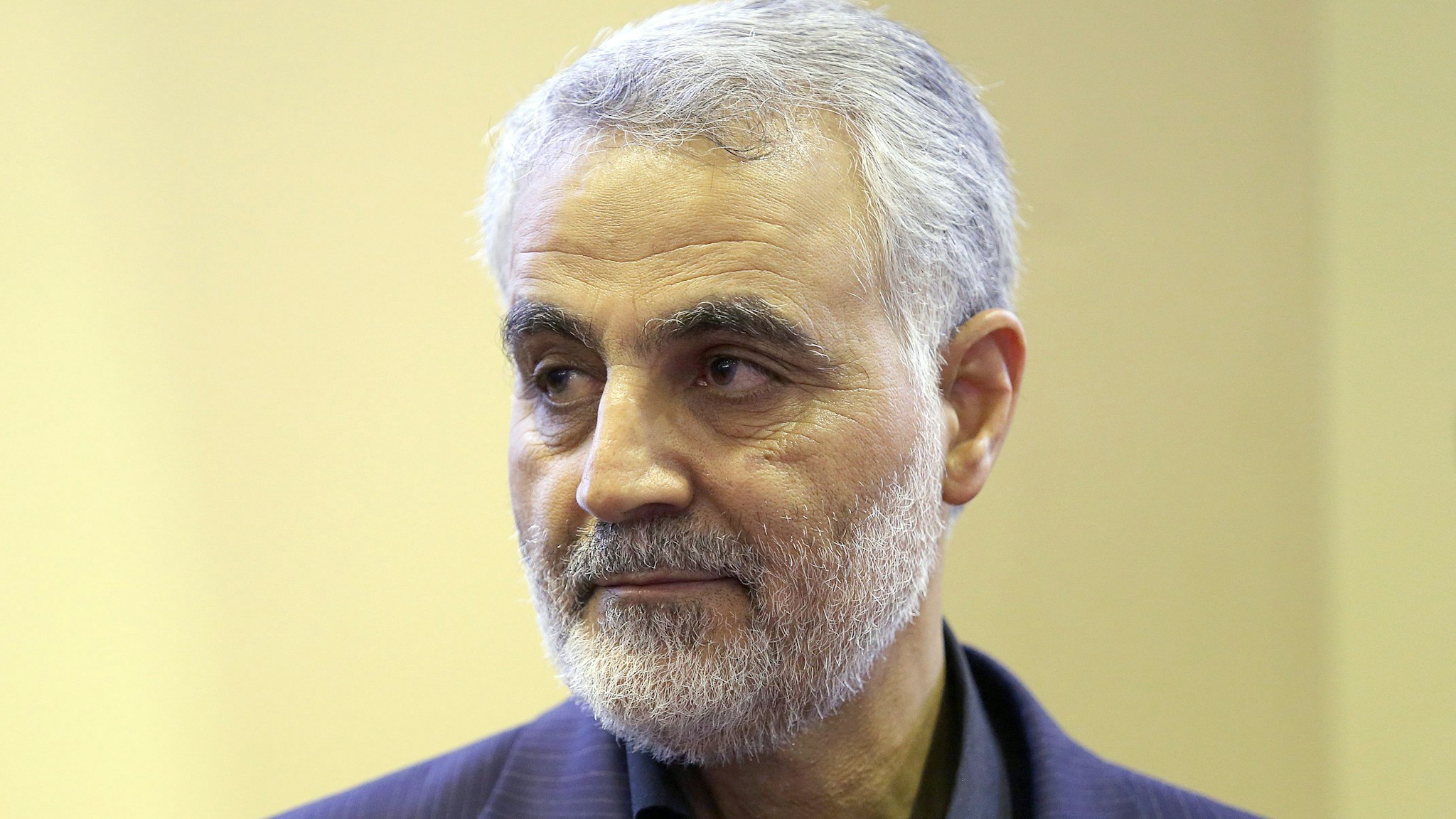(FILES) In this picture taken on September 14, 2013, the commander of the Iranian Revolutionary Guard's Quds Force, Gen. Qassem Soleimani, is seen as people pay their condolences following the death of his mother in Tehran. For a man widely reported to be playing a key role in helping Iraq's routed military recover lost ground, Qassem Soleimani, 57, the commander of Iran's feared Quds Force, remains invisible.