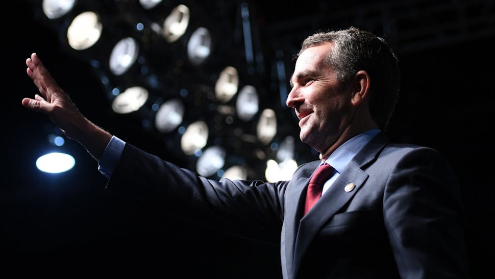 Ralph Northam Democratic Gubernatorial Candidate Ralph Northam waves as he arrives to speak during a campaign rally in Richmond, Virginia on October 19, 2017.